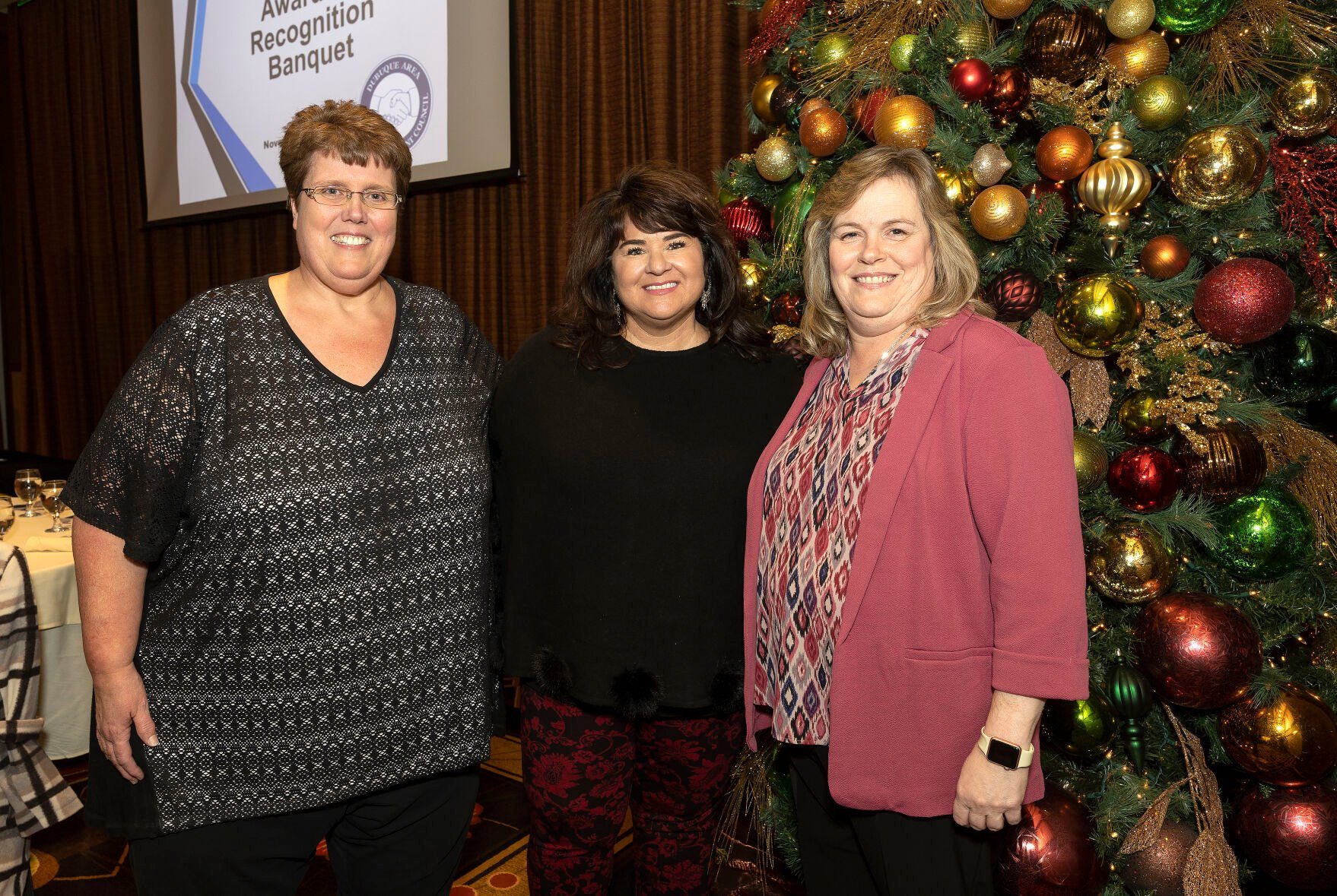 (From left) Tammy Duehr and Angela Bowersox received the Good Faith in Collective Bargaining Award and Shelly Freiburger received the Community Service Award, IBEW Local 704, at the Dubuque Area Labor-Management Awards at the Diamond Jo Casino on Tuesday, Nov. 22.    PHOTO CREDIT: Stephen Gassman