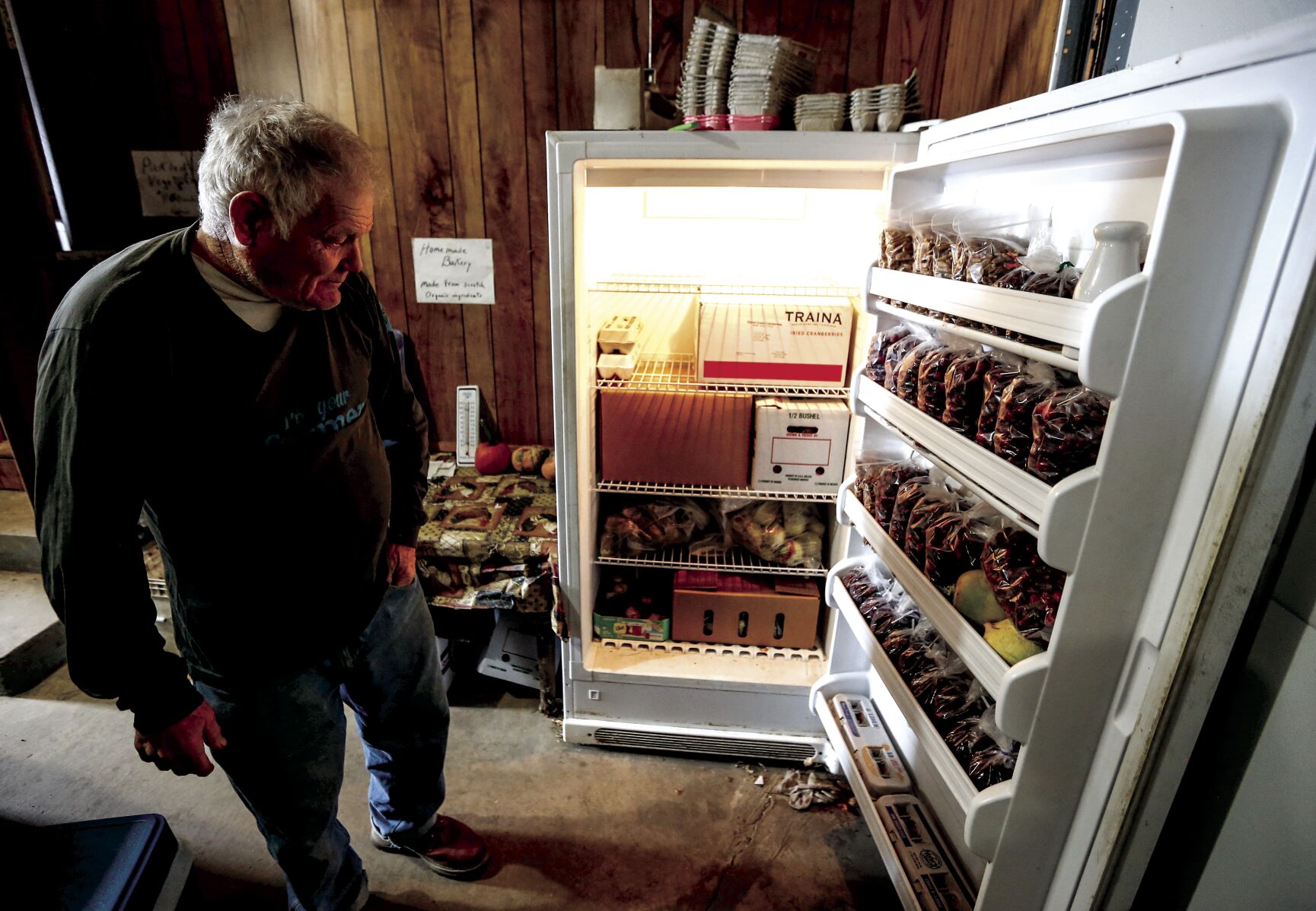 Walter Hammerand, owner of Hammerand Farm in Fennimore, Wis., takes inventory of his goods he sells at various farmers markets. He sells organic produce and products, and continues a longtime family tradition of selling at farmers markets.    PHOTO CREDIT: Dave Kettering
Telegraph Herald