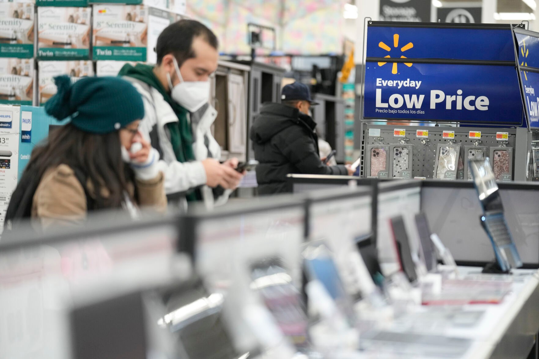 <p>FILE - Signs advertise deals and low prices at a Walmart in Secaucus, N.J., Tuesday, Nov. 22, 2022. On Tuesday the Conference Board reports on U.S. consumer confidence for November. (AP Photo/Seth Wenig, File)</p>   PHOTO CREDIT: Seth Wenig - staff, AP
