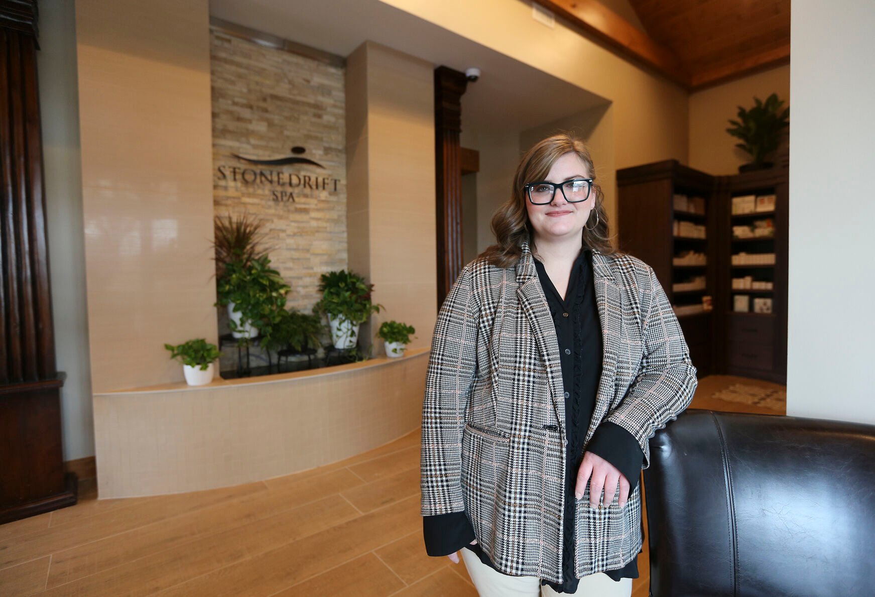 Director of Stonedrift Spa Abbi Porter stands in the lobby of the business located in the Galena Territories on Wednesday, Nov. 30, 2022.    PHOTO CREDIT: Dave Kettering