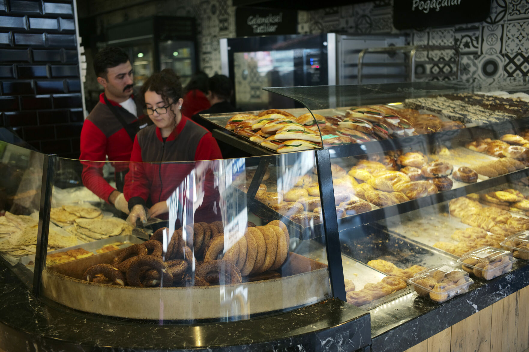 <p>Two young people work at a traditional bakery in Ankara, Turkey, Monday, Dec. 5, 2022. Annual inflation in Turkey slightly eased in November for the first time in more than a year, according to official figures released on Monday, although it remains close to 24-year highs. (AP Photo/Burhan Ozbilici)</p>   PHOTO CREDIT: Burhan Ozbilici - staff, AP