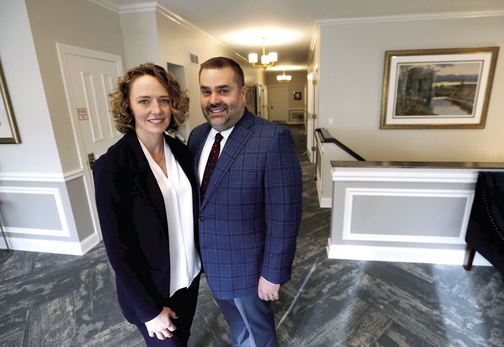 Theresa and Adam Thielen, co-owners of Hoffmann Schneider & Kitchen Funeral Home and Crematory in Dubuque, are offering new amenities this year.    PHOTO CREDIT: JESSICA REILLY