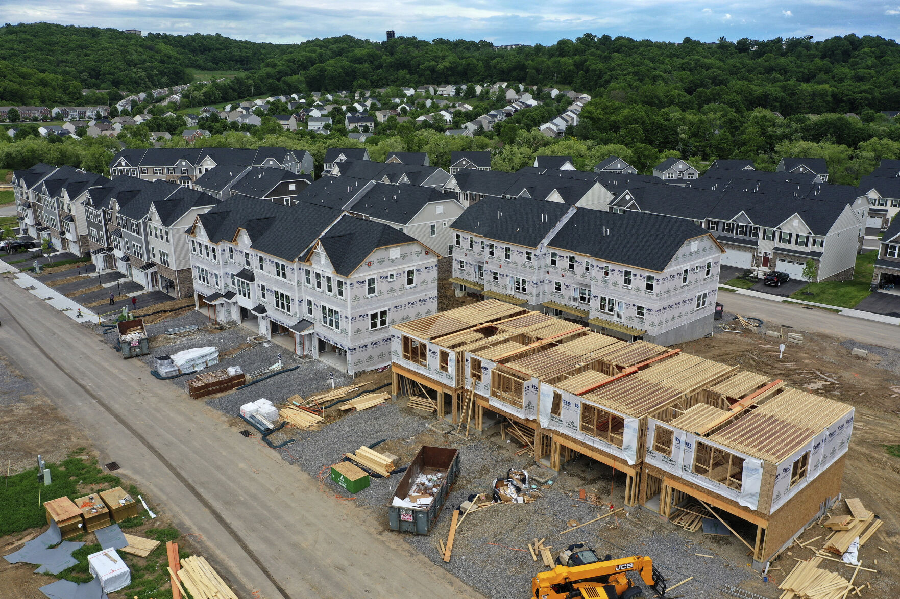 <p>FILE - Houses under construction are seen in Mars, Pa., on May, 27, 2022. Homebuilders have pumped the brakes on new single-family home construction this year, a trend that’s likely to extend into 2023, according to several forecasts. (AP Photo/Gene J. Puskar, File)</p>   PHOTO CREDIT: Gene J. Puskar - staff, AP