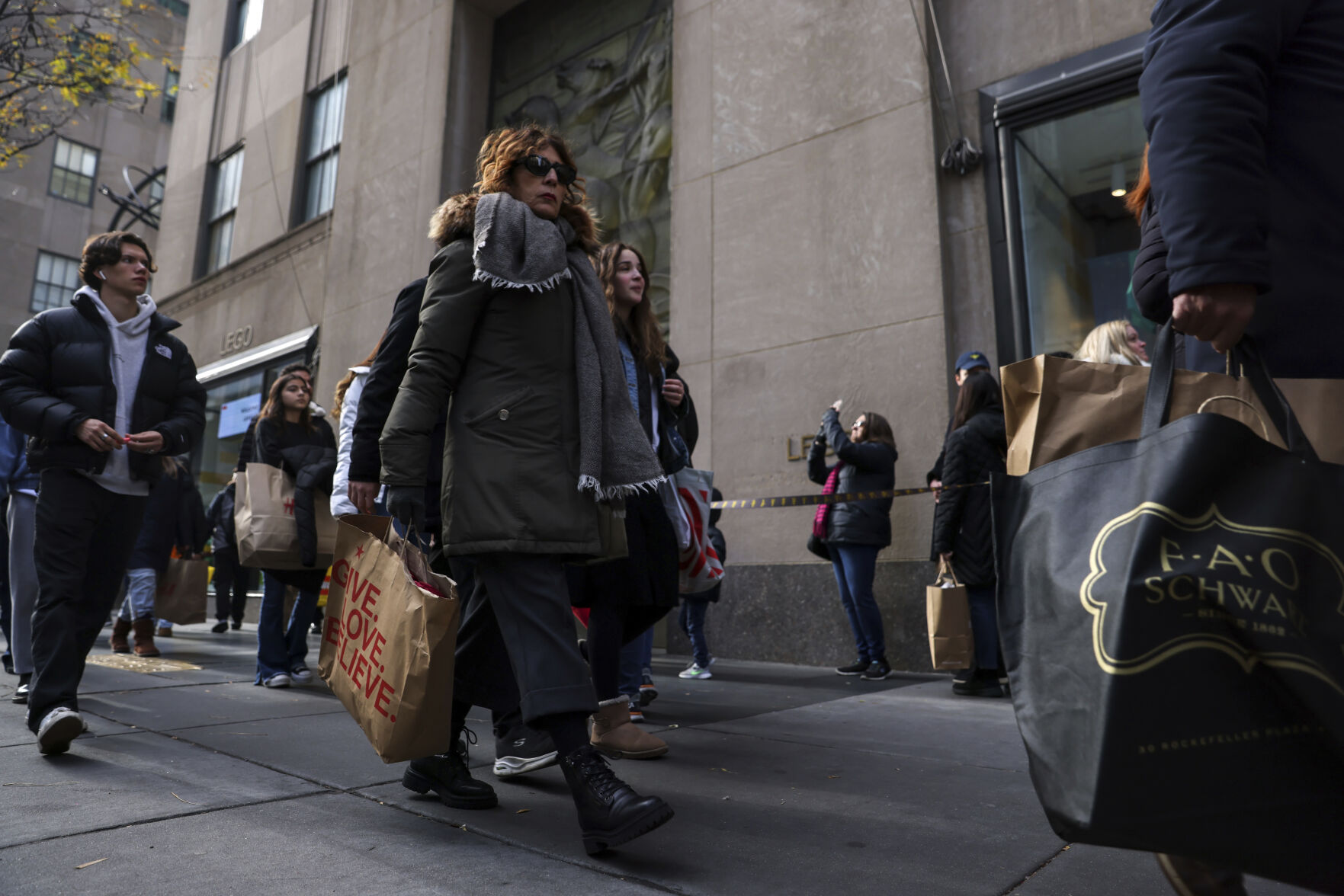 <p>Shoppers carry bags down Fifth Avenue on Friday, Nov. 25, 2022, in New York. The Commerce Department releases retail sales data for November on Friday, Dec. 15.(AP Photo/Julia Nikhinson, File)</p>   PHOTO CREDIT: Julia Nikhinson - staff, AP