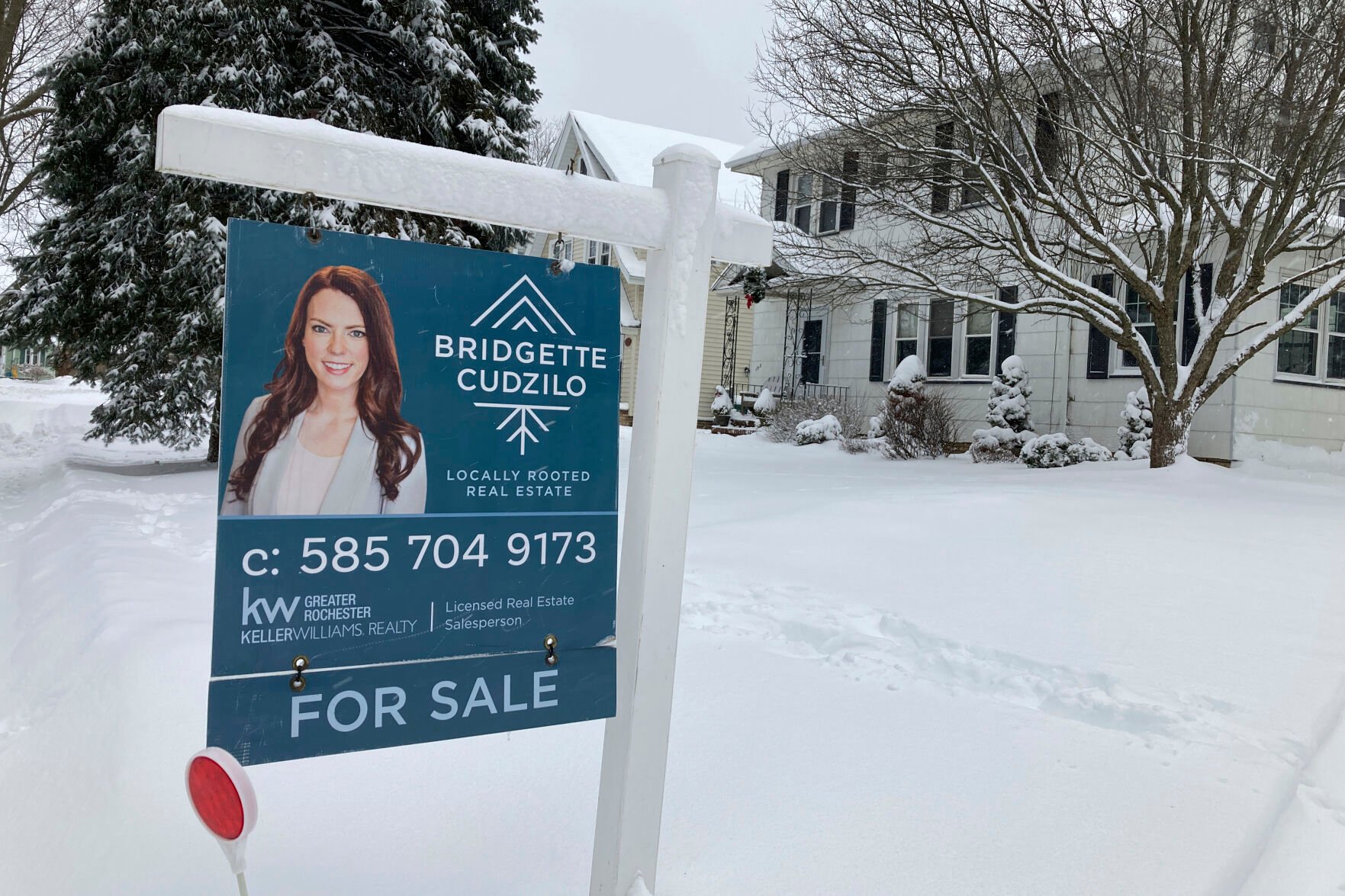 <p>FILE - A "For Sale" sign stands in front of a house in Rochester, New York, on Monday, January 17, 2022. On Wednesday the National Association of Realtors reports on sales of existing homes in November. (AP Photo/Ted Shaffrey, File)</p>   PHOTO CREDIT: Ted Shaffrey - staff, AP