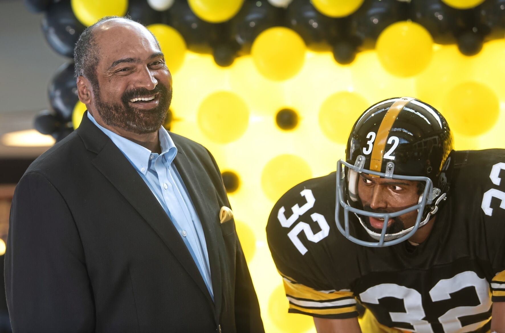 <p>FILE - Former Pittsburgh Steelers running back Franco Harris stands next a statute of himself on Sept. 12, 2019, at Pittsburgh International Airport near Pittsburgh. Harris died on Wednesday morning, Dec. 21, 2022, at age 72, just two days before the 50th anniversary of The Immaculate Reception. (Nate Guidry/Pittsburgh Post-Gazette via AP, File)</p>   PHOTO CREDIT: Nate Guidry - member image share, Pittsburgh Post-Gazette