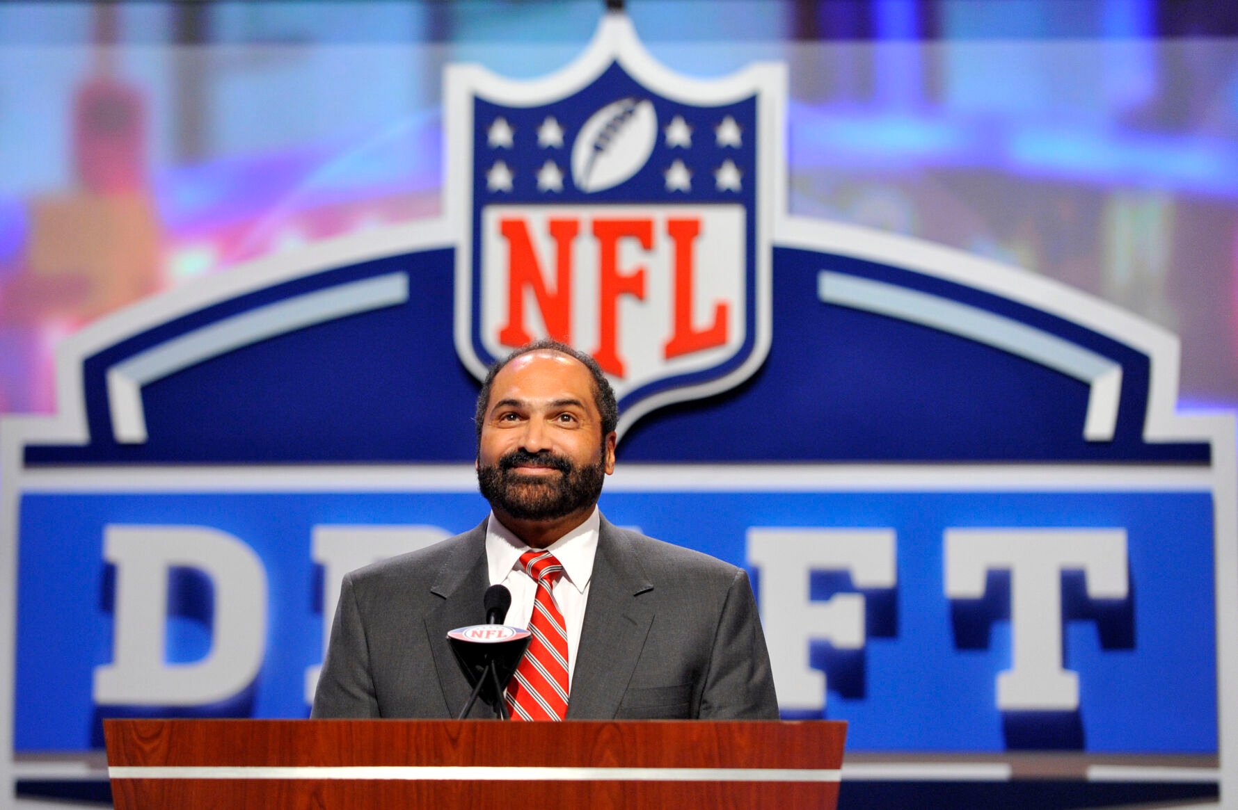 <p>FILE - Hall of Fame Pittsburgh Steeler Franco Harris announces a draft pick during the second round of the NFL Draft at Radio City Music Hall on April 29, 2011, in New York. Harris died on Wednesday morning, Dec. 21, 2022, at age 72, just two days before the 50th anniversary of The Immaculate Reception. (AP Photo/Stephen Chernin, File)</p>   PHOTO CREDIT: Stephen Chernin - freelancer, FR76594 AP