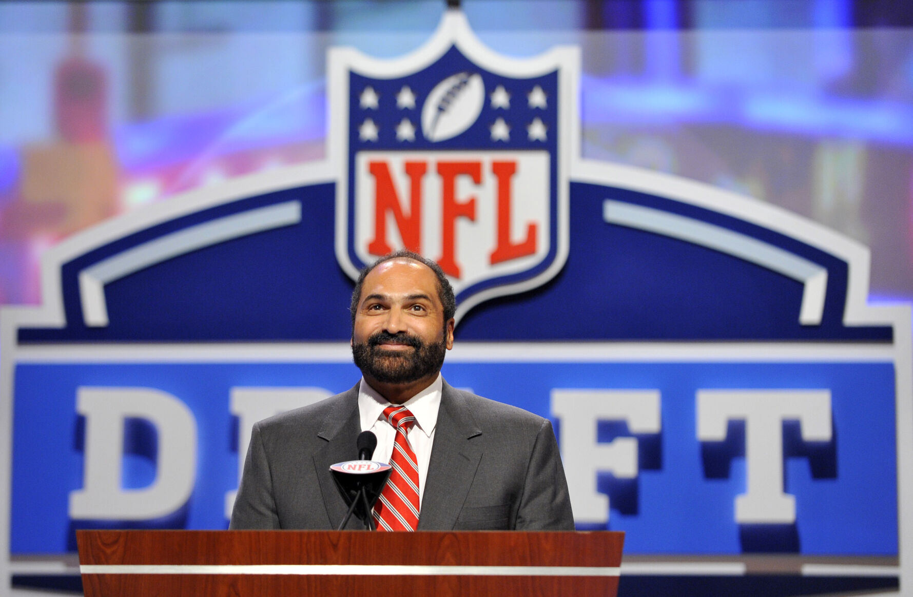 <p>FILE - Hall of Fame Pittsburgh Steeler Franco Harris announces a draft pick during the second round of the NFL Draft at Radio City Music Hall on April 29, 2011, in New York. Harris died on Wednesday morning, Dec. 21, 2022, at age 72, just two days before the 50th anniversary of The Immaculate Reception. (AP Photo/Stephen Chernin, File)</p>   PHOTO CREDIT: Stephen Chernin - freelancer, FR76594 AP