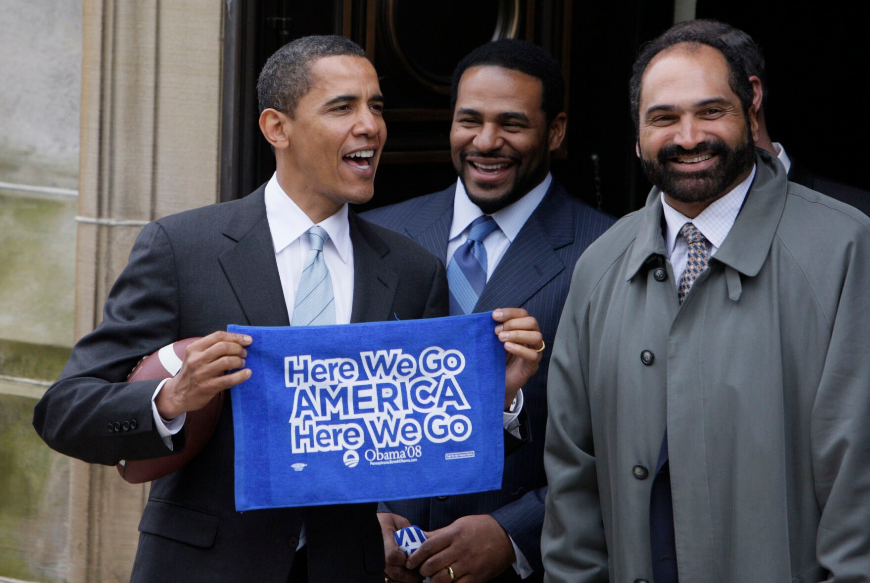 <p>FILE - Democratic presidential hopeful Sen. Barack Obama D-Ill., from left, accompanied by former Pittsburgh Steelers NFL football players Jerome Bettis and Franco Harris, holds up a towel as they leave the Soldiers and Sailors Museum and Memorial in Pittsburgh, Pa., on March 28, 2008. Harris died on Wednesday morning, Dec. 21, 2022, at age 72, just two days before the 50th anniversary of The Immaculate Reception. (AP Photo/Alex Brandon, File)</p>   PHOTO CREDIT: Alex Brandon - staff, AP