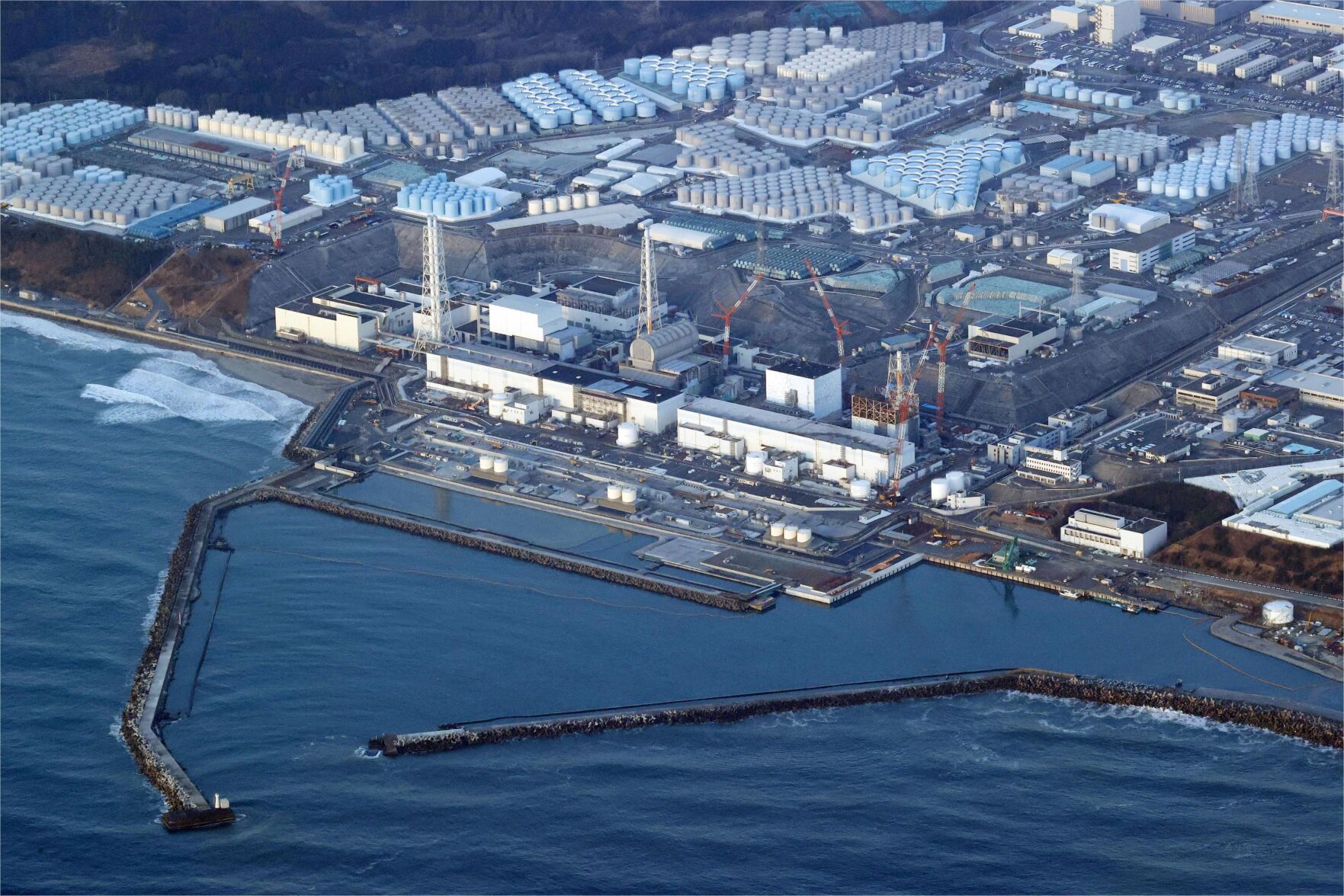 <p>FILE - This aerial photo shows the Fukushima Daiichi nuclear power plant in Okuma town, Fukushima prefecture, north of Tokyo, on March 17, 2022. Japan on Thursday, Dec. 22, adopted a new policy promoting greater use of nuclear energy to ensure a stable power supply amid global fuel shortages and reduce carbon emissions - a major reversal of its phase-out plan since the Fukushima crisis. (Shohei Miyano/Kyodo News via AP, File)</p>   PHOTO CREDIT: Shohei Miyano - foreign subscriber, Kyodo News