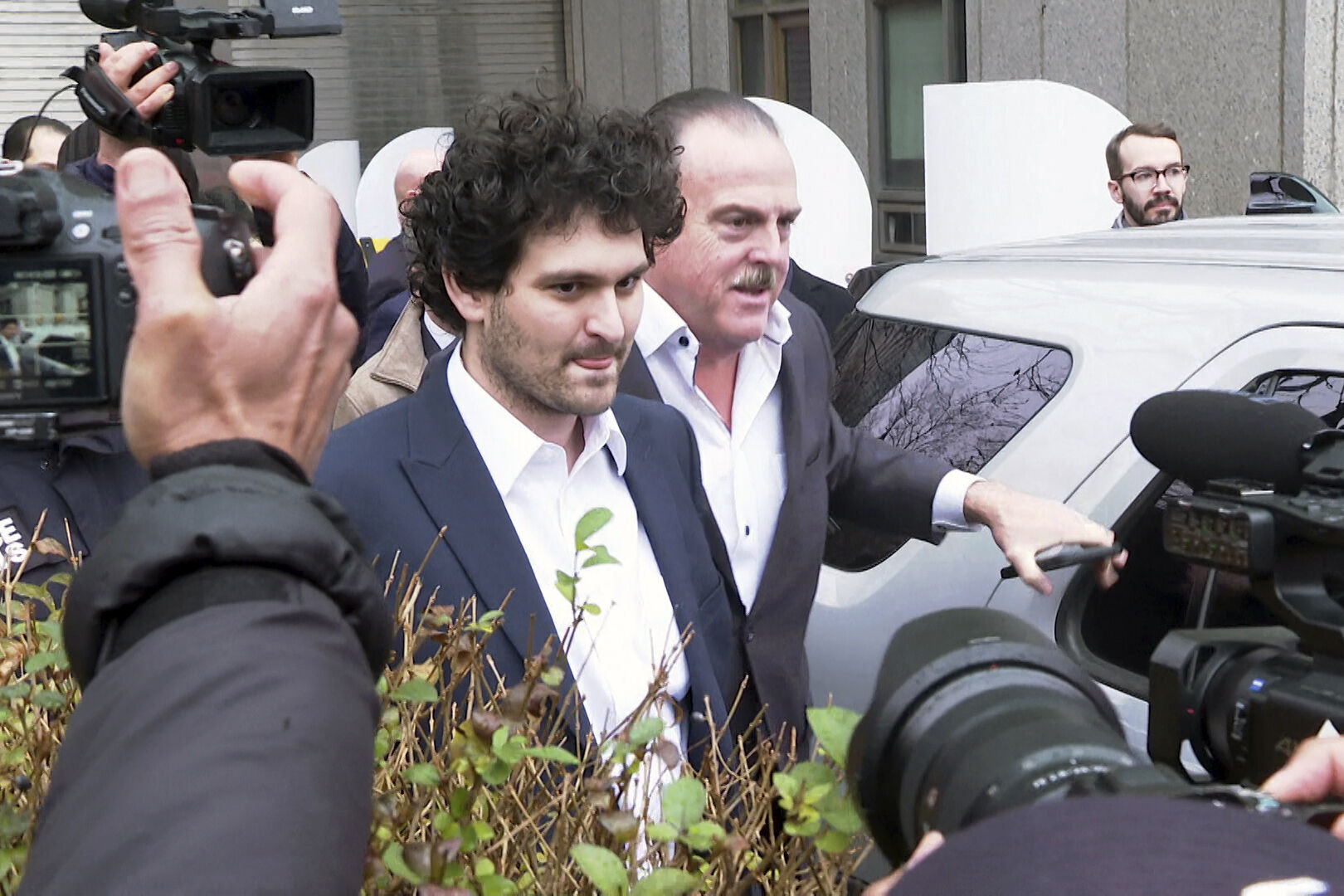 <p>Cryptocurrency entrepreneur Sam Bankman-Fried leaves Manhattan federal court on bail ,Thursday, Dec. 22, 2022 in New York. Bankman-Fried is accused of swindling investors and looting customer deposits on his FTX trading platform. (AP Photo/Ted Shaffrey)</p>   PHOTO CREDIT: Ted Shaffrey - staff, AP