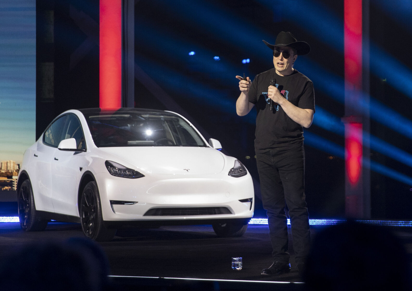 <p>FILE - Tesla CEO Elon Musk speaks at the "Cyber Rodeo" grand opening celebration for the new $1.1 billion Tesla Giga Texas manufacturing facility in Austin, Texas, on Thursday April 7, 2022. Musk says he won’t sell any more shares in Tesla for 18 months or more, likely an attempt to comfort shareholders of the electric vehicle company who have watched the stock lose nearly half of its value since Musk’s purchase of Twitter went through in October. (Jay Janner/Austin American-Statesman via AP, File)</p>   PHOTO CREDIT: Jay Janner - member, Austin American-Statesman