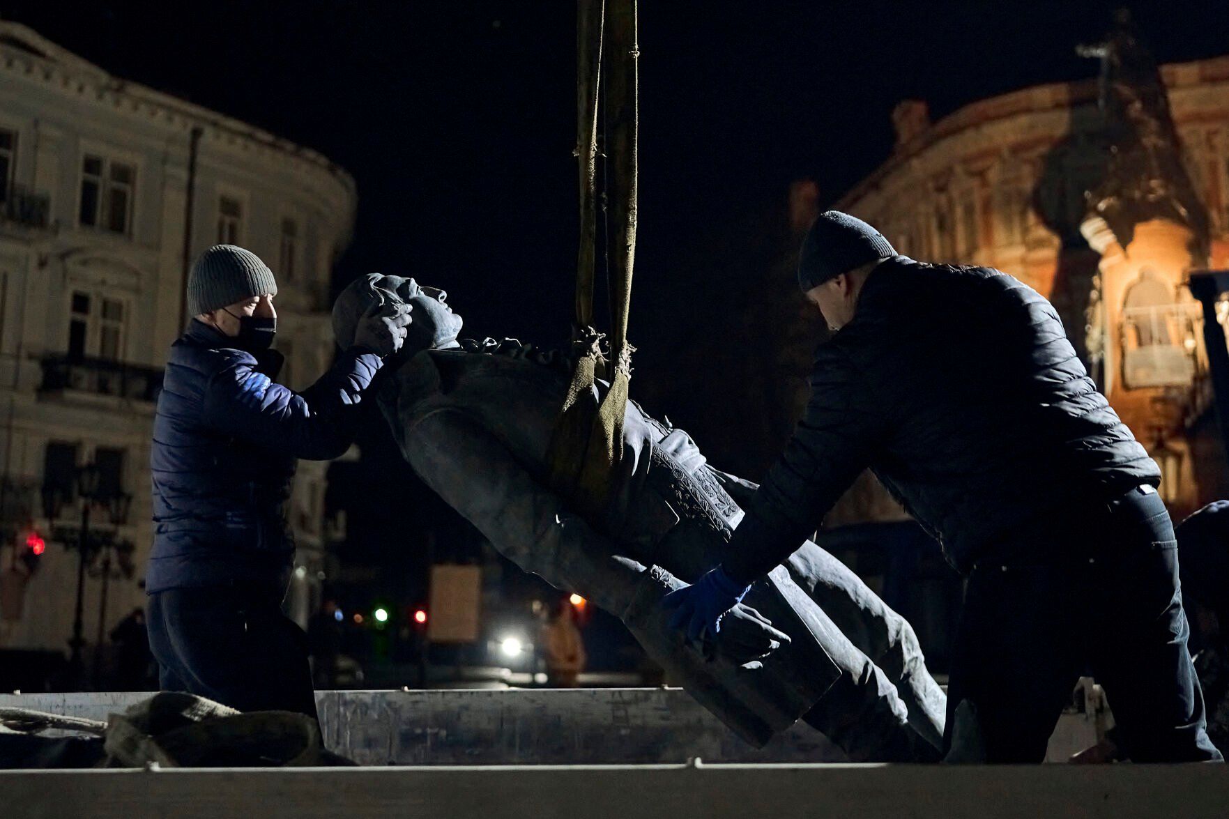 <p>Workers remove part of the monument to Catherine II, also known as "Monument to the Founders of Odesa" in Odesa, Ukraine, late Wednesday, Dec. 28, 2022. The decision to dismantle the monument consisting of sculptures of Russian Empress Catherine II and her associates was made recently by Odesa residents by electronic voting. (AP Photo/LIBKOS)</p>   PHOTO CREDIT: LIBKOS 