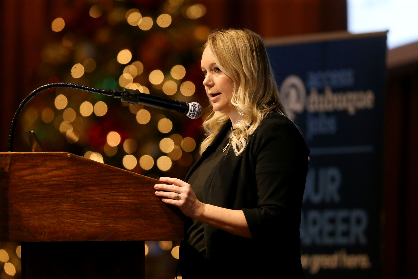 Mandi Dolson, director of workforce recruitment and retention at Greater Dubuque Development Corp., speaks during the organization’s workforce breakfast at Diamond Jo Casino in Dubuque on Friday, Dec. 9, 2022.    PHOTO CREDIT: JESSICA REILLY