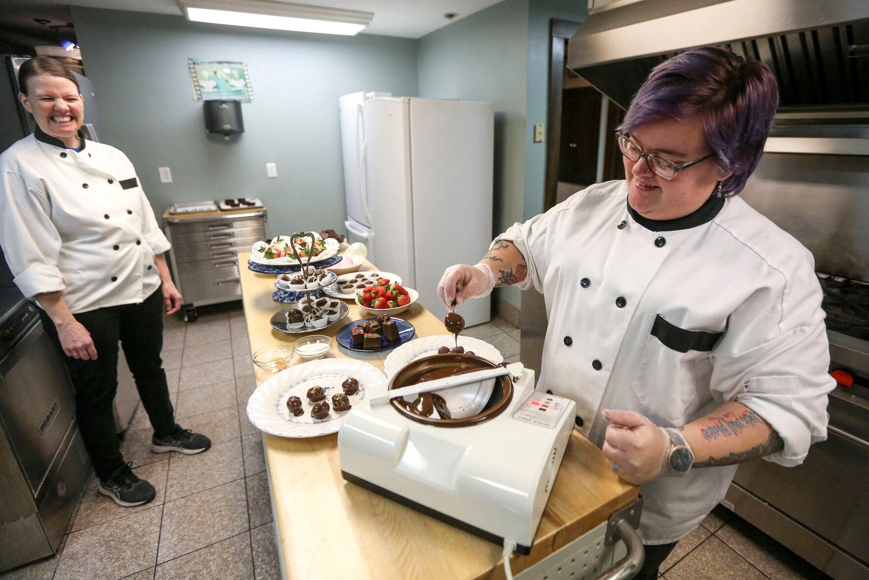 Charity Starbuck (right), baker and manager at Field of Chocolate Dreams, makes truffles along with assistant Naomi Kueter at Mont Rest Inn in Bellevue, Iowa.    PHOTO CREDIT: Dave Kettering