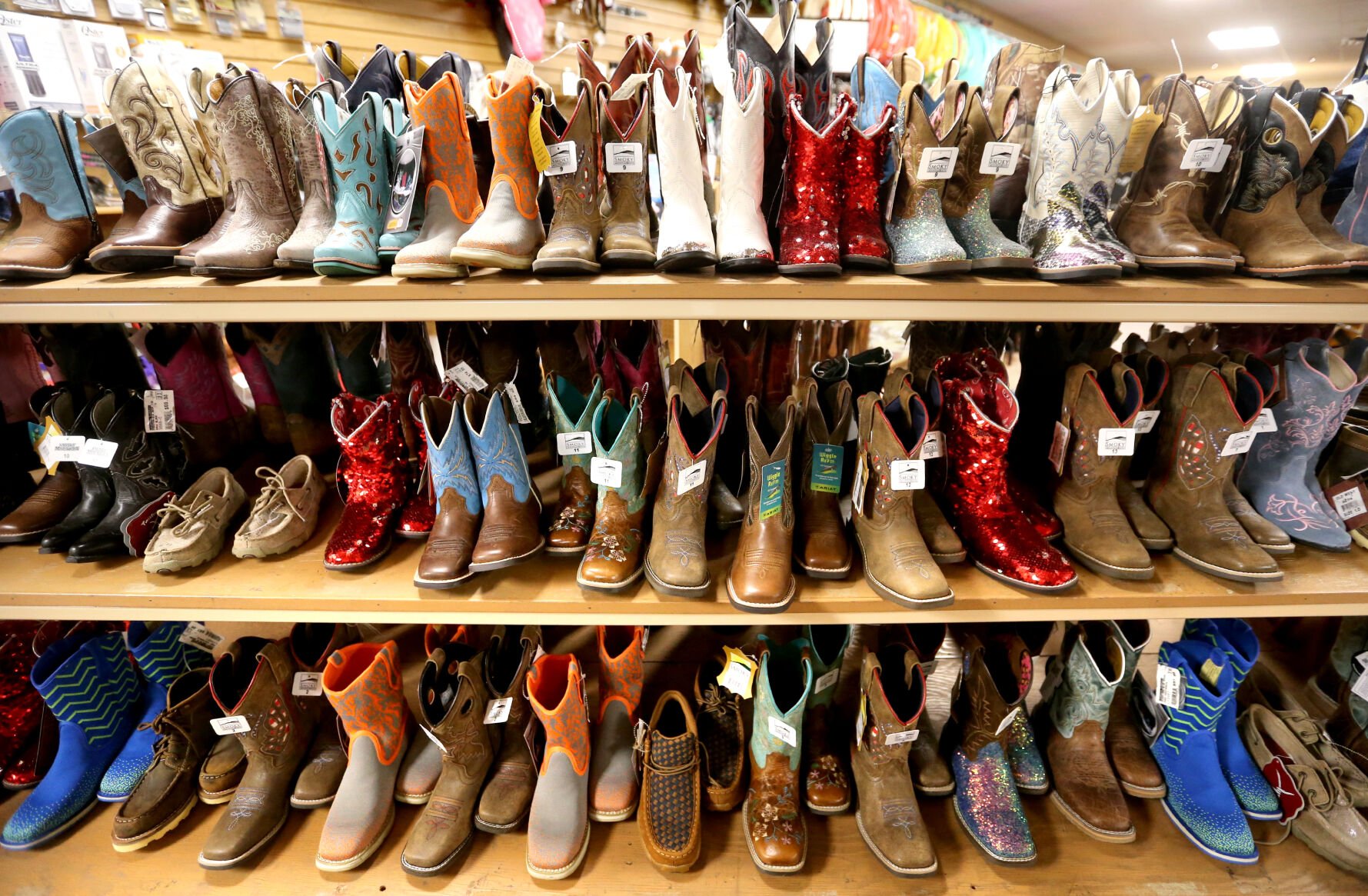 Boots are displayed at Longhorn Saddlery in Dubuque on Friday, Dec. 30, 2022.    PHOTO CREDIT: JESSICA REILLY