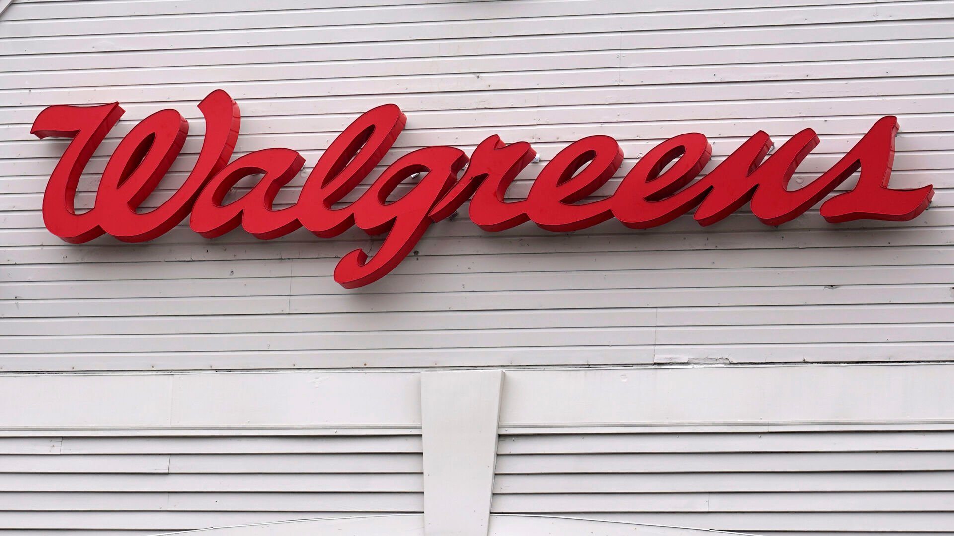 <p>FILE - The Walgreens logo on the front of a store, July 14, 2021, in Cambridge, Mass. A huge opioid settlement dragged Walgreens to a $3.7 billion loss in its fiscal first quarter, but the drugstore chain still beat Wall Street forecasts. The company also reaffirmed its earnings forecast for the new year. Walgreens said Thursday, Jan. 5, 2023 that it recorded a $5.2-billion, after-tax charge in the quarter that ended November 30 for opioid-related litigation. (AP Photo/Charles Krupa, File)</p>   PHOTO CREDIT: Charles Krupa 
