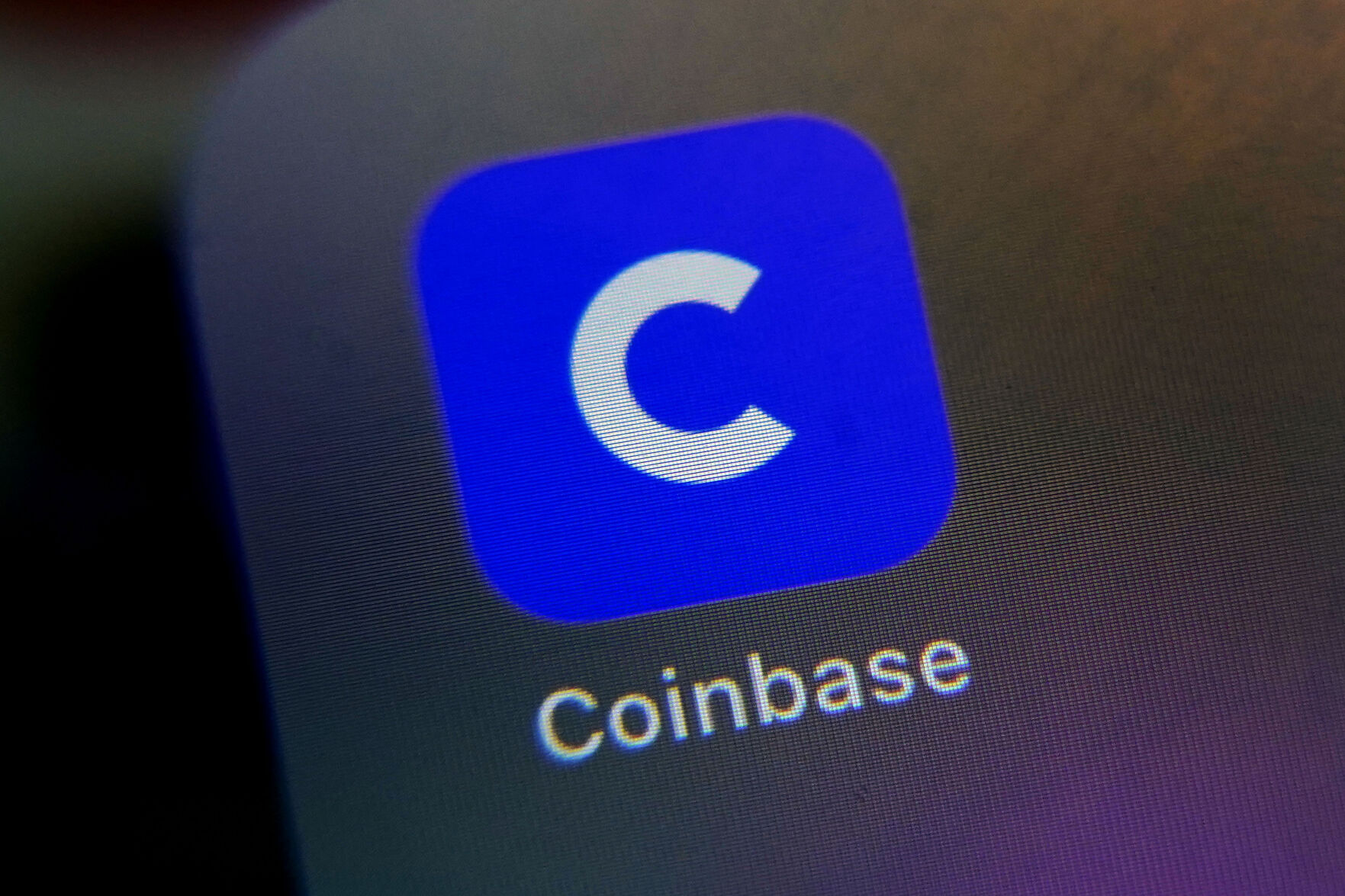 <p>FILE - The mobile phone icon for the Coinbase app is shown in this photo, in New York, Tuesday, April 13, 2021. Coinbase said in a regulatory filing on Tuesday, Jan. 10, 2023, it is cutting approximately 950 jobs, or 20% of its workforce, in a second round of layoffs. (AP Photo/Richard Drew, File)</p>   PHOTO CREDIT: Richard Drew 