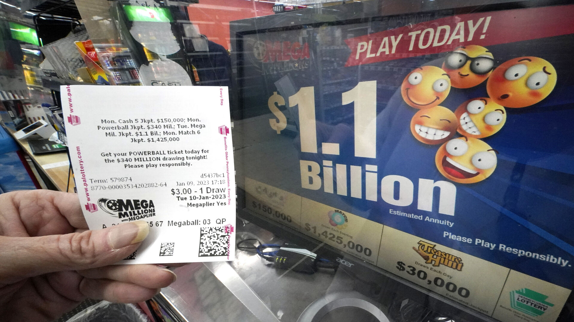 <p>A Mega Millions customer displays her ticket for the estimated jackpot of $1.1 Billion at the Fuel On Convenience Store in Pittsburgh, Monday, Jan. 9, 2023. (AP Photo/Gene J. Puskar)</p>   PHOTO CREDIT: Gene J. Puskar 