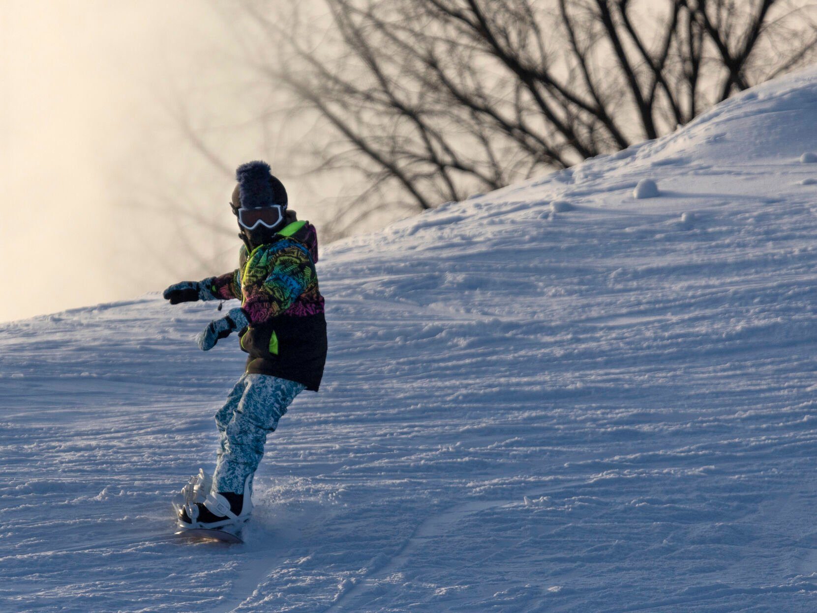 A young snowboarder glides down a slope at Sundown Mountain Resort, west of Dubuque and Asbury, Iowa, earlier this month. The resort is celebrating 50 seasons in operation this winter.    PHOTO CREDIT: Stephen Gassman