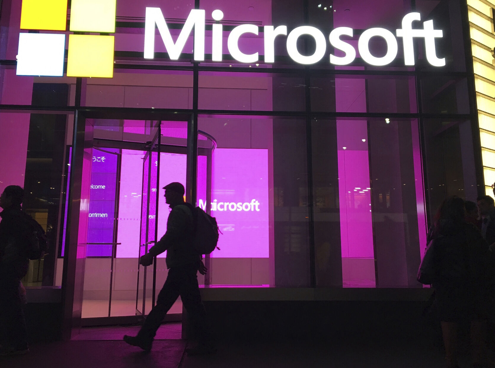 <p>FILE - People walk past a Microsoft office in New York, Nov. 10, 2016. On Tuesday, Jan. 24, 2023, Microsoft reported a 12% drop in profit for the October-December 2022 quarter, reflecting the economic uncertainty it said led to its decision to cut 10,000 workers. (AP Photo/Swayne B. Hall, File)</p>   PHOTO CREDIT: Swayne B. Hall 