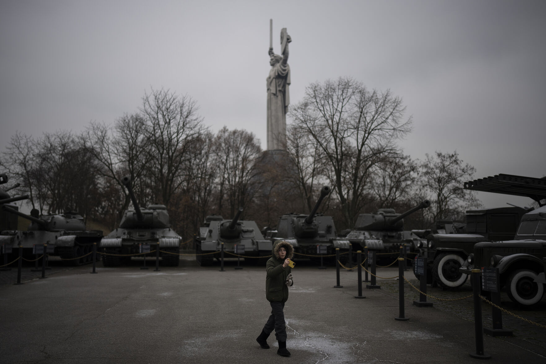 <p>A boy takes pictures of old tanks on display at a war museum in Kyiv, Ukraine, Wednesday, Jan. 25, 2023. (AP Photo/Daniel Cole)</p>   PHOTO CREDIT: Daniel Cole - stringer, AP