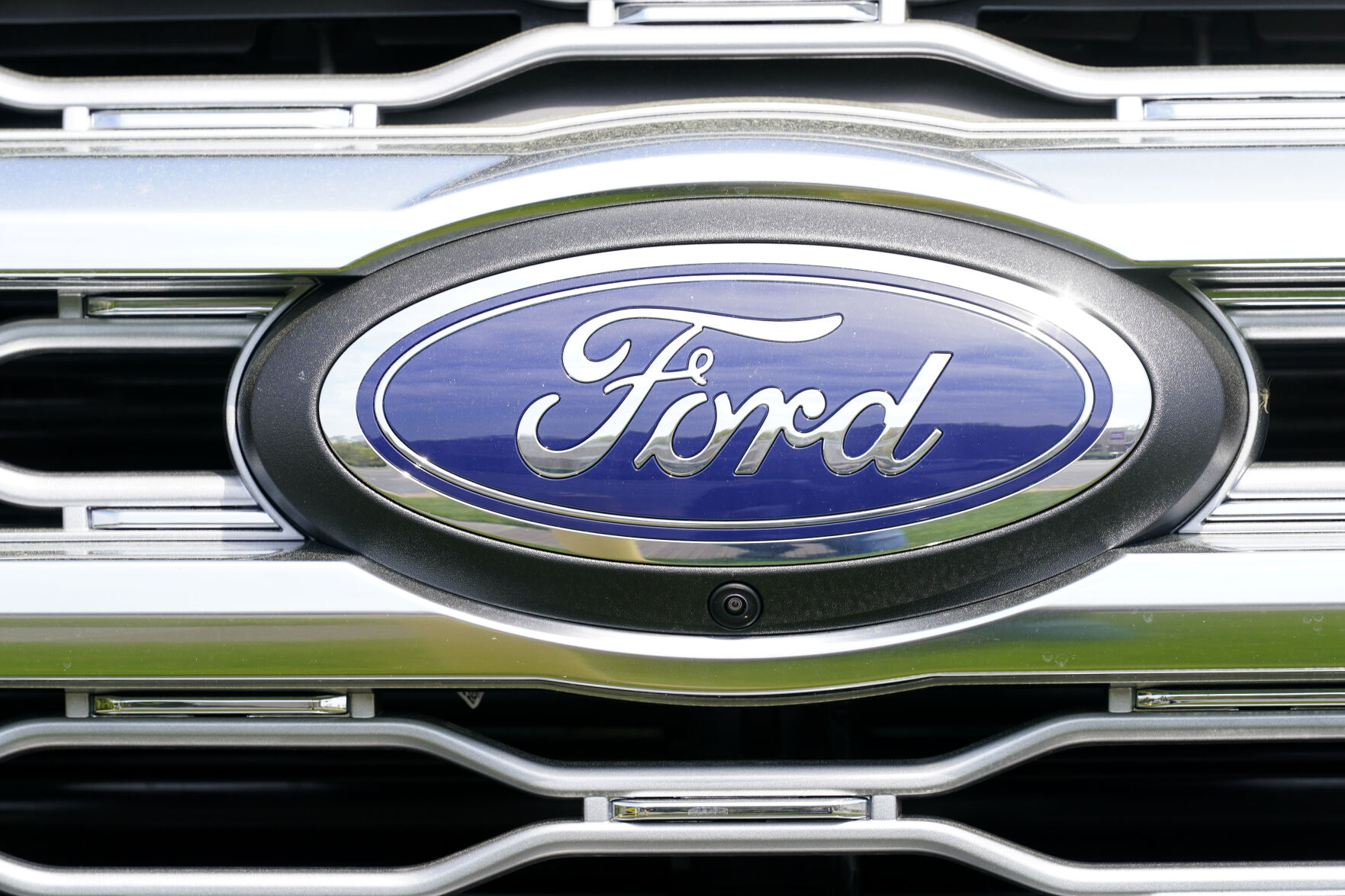 <p>FILE - A logo on a vehicle at a Ford dealership in Springfield, Pa., Tuesday, April 26, 2022. The U.S. government’s road safety agency is investigating complaints that windshield trim panels can fly off of Ford Explorers while they’re traveling at highway speeds, Tuesday, Jan. 31, 2023. The National Highway Traffic Safety Administration says it has 164 complaints about the trim pieces detaching on 2011 through 2019 Explorer SUVs. (AP Photo/Matt Rourke, File)</p>   PHOTO CREDIT: Matt Rourke 