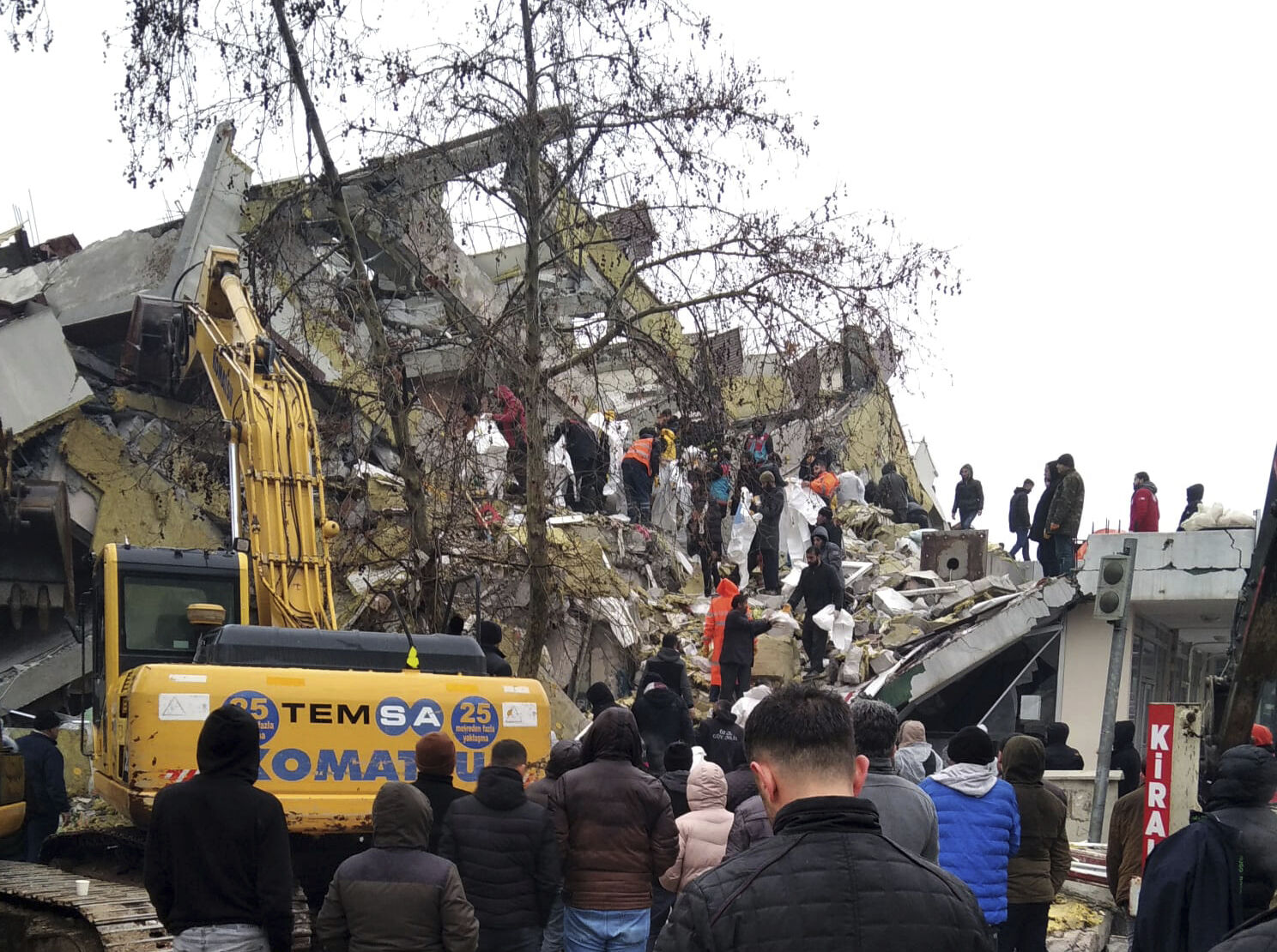 <p>Rescue workers try to reach trapped residents in a collapsed building in Kahta, in Adiyaman province, southeastern Turkey, Monday, Feb. 6, 2023. A powerful earthquake that struck southeast Turkey and northern Syria has killed more than 640 people with hundreds injured. The toll is expected to rise as rescuers search for dead and survivors in dozens of collapsed buildings across the region. (AP Photo)</p>   PHOTO CREDIT: AP photo
