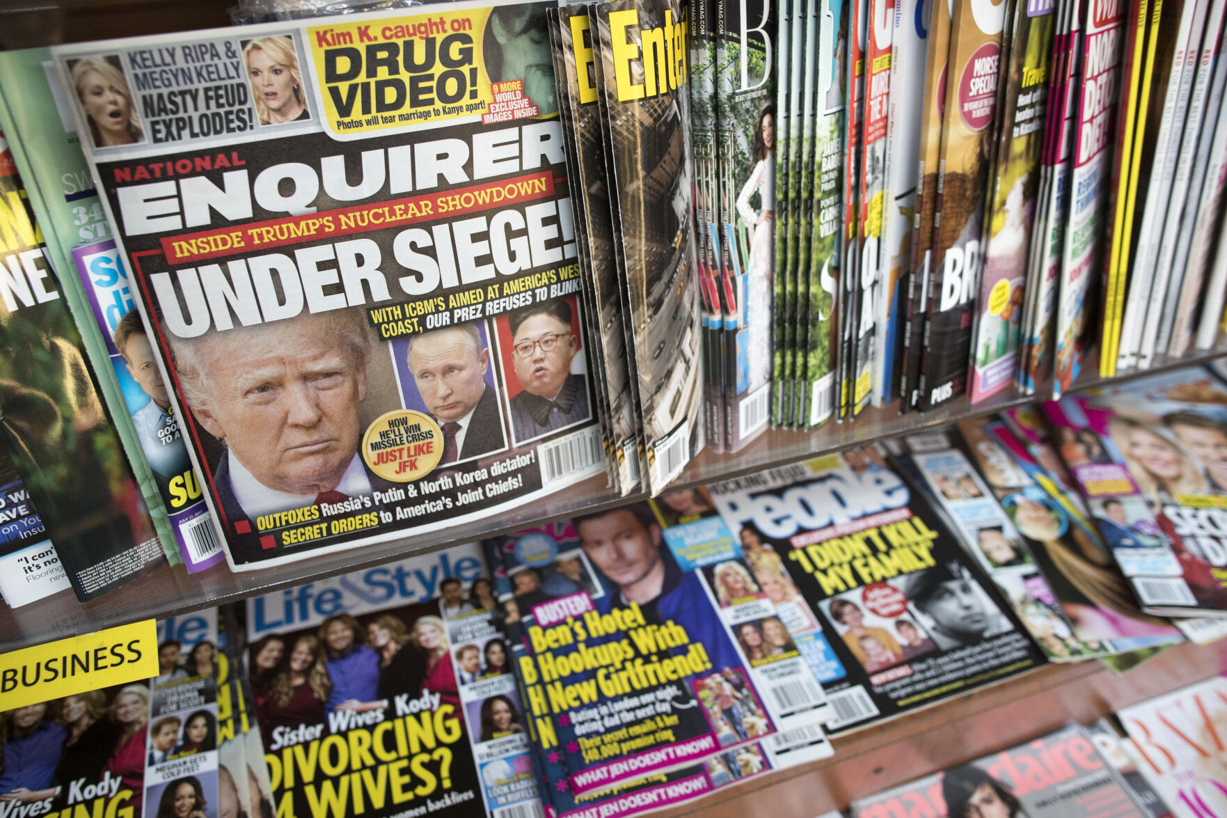 <p>FILE - In this July 12, 2017 file photo, an issue of the National Enquirer featuring President Donald Trump on its cover is displayed on a newsstand in a store in New York. VVIP Ventures is buying the U.S. and U.K editions of the National Enquirer, the tabloid that engaged in “catch-and-kill” practices to bury stories about Donald Trump during his presidential campaign. Financial terms were not disclosed. (AP Photo/Mary Altaffer, File)</p>   PHOTO CREDIT: Mary Altaffer 