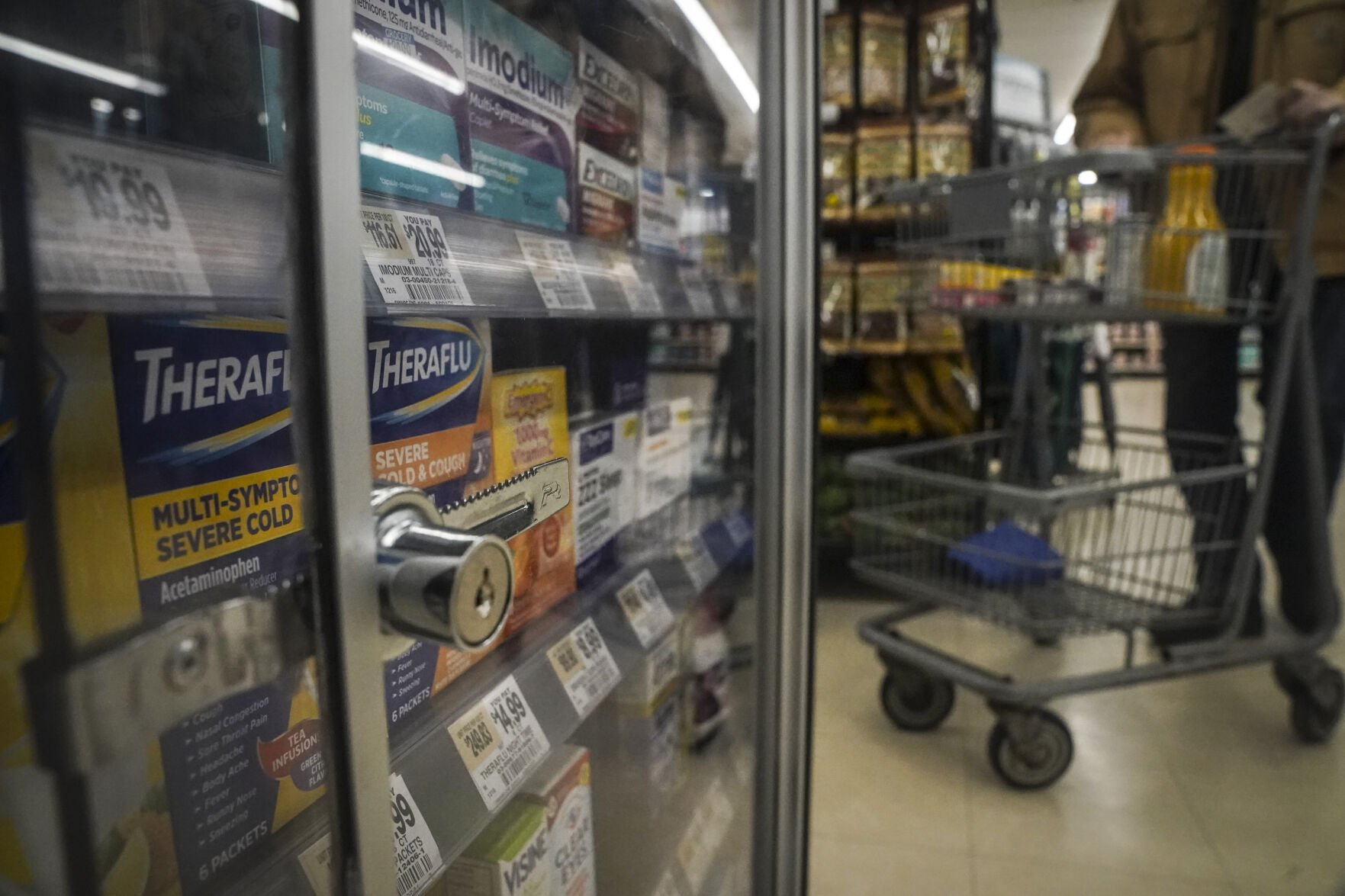 <p>Pharmaceutical items are kept locked in a glass cabinet at a Gristedes supermarket, Tuesday Jan. 31, 2023, in New York. Increasingly, retailers are locking up more products or increasing the number of security guards at their stores to curtail theft. (AP Photo/Bebeto Matthews)</p>   PHOTO CREDIT: Bebeto Matthews 