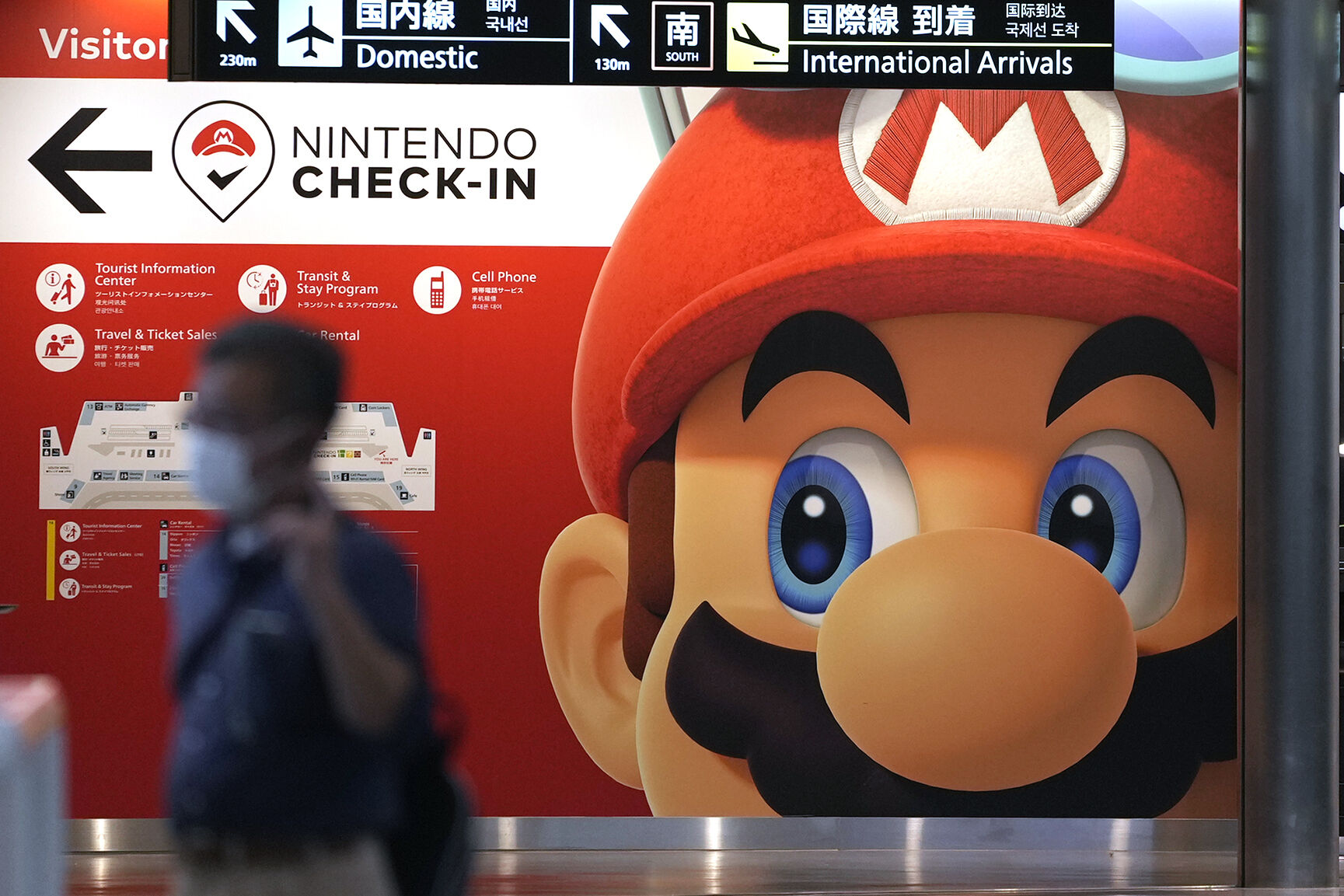 <p>FILE - A traveler walks past an advertisement featuring a Nintendo character at Narita airport in Narita near Tokyo Friday, June 10, 2022. Japanese video game maker Nintendo recorded a slight drop in in profit in April to December 2022 as it maintained strong sales of its Switch console games. (AP Photo/Shuji Kajiyama, File)</p>   PHOTO CREDIT: Shuji Kajiyama 