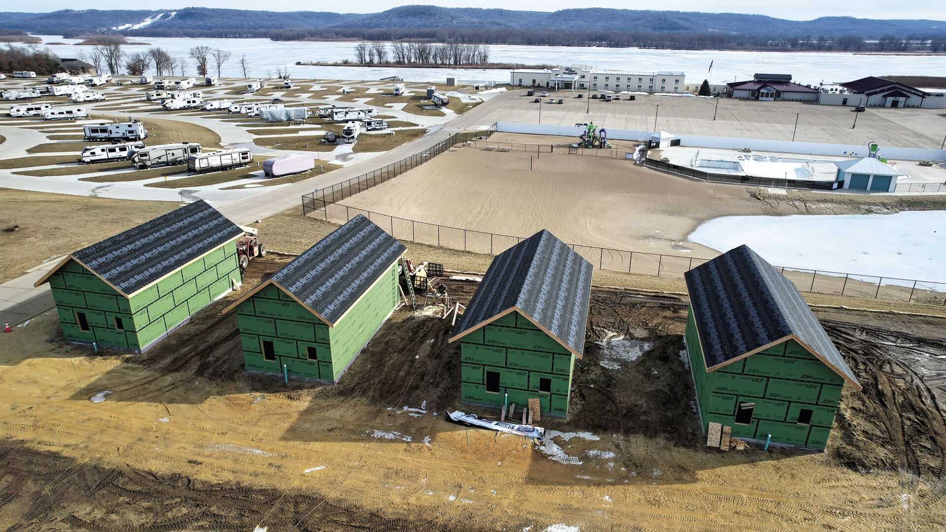 Construction crews work on building four villas at the Off Shore Hotel & Resort in Bellevue, Iowa, last week. The new villas are located on the southeast side of the resort, with views of the Mississippi River.    PHOTO CREDIT: Dave Kettering