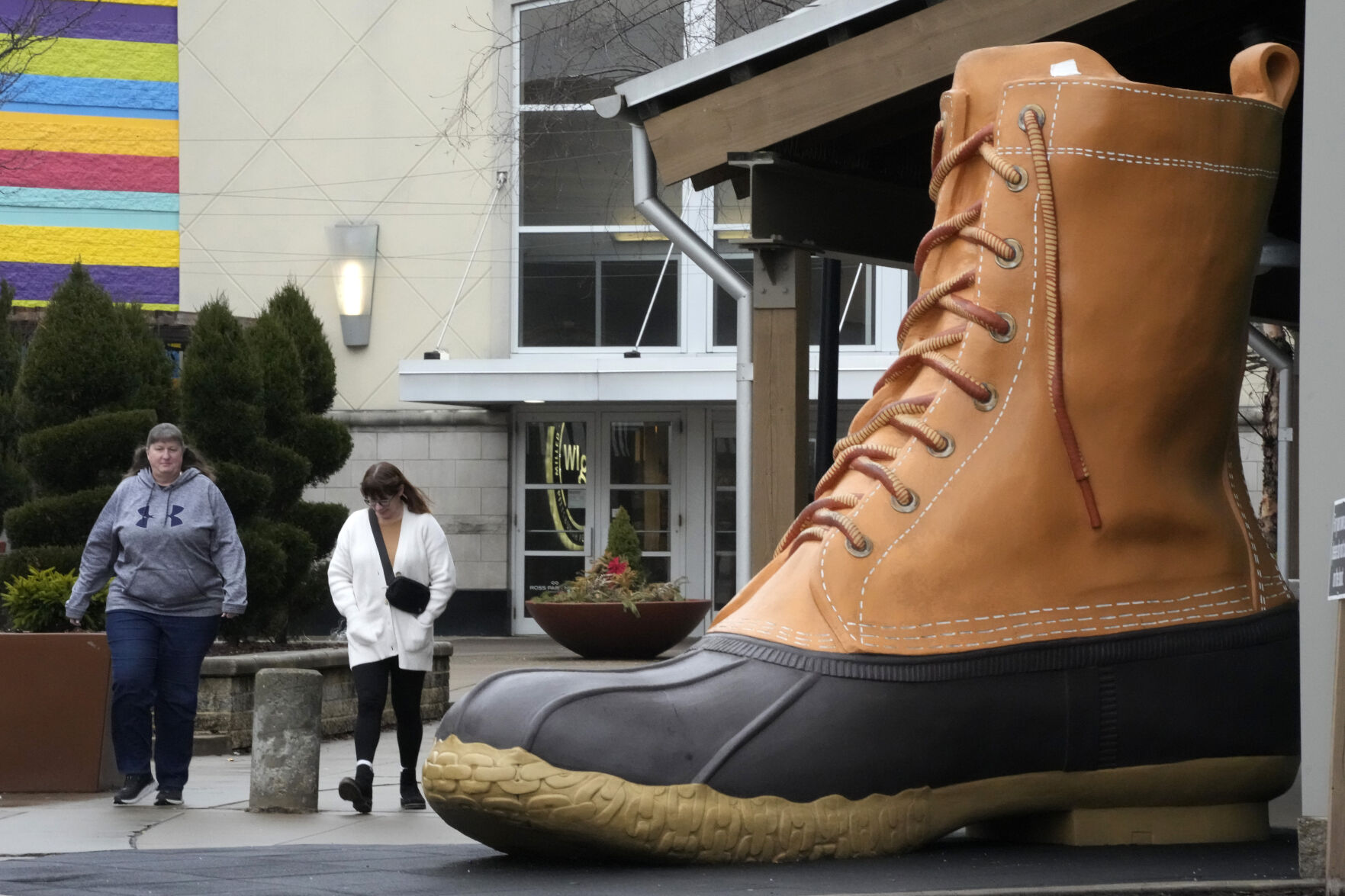 <p>Shoppers pass an large L.L. Bean boot displayed outside an L.L. Bean store in Pittsburgh on Monday, Jan. 30, 2023. On Wednesday, the Commerce Department releases U.S. retail sales data for January. (AP Photo/Gene J. Puskar)</p>   PHOTO CREDIT: Gene J. Puskar 