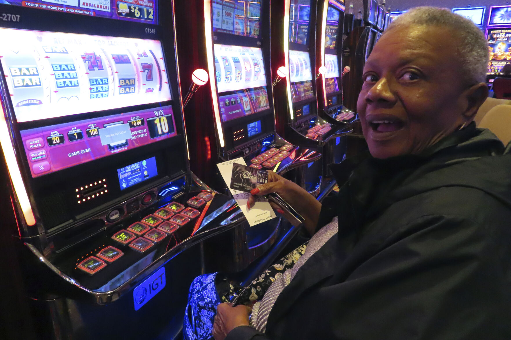 <p>A gambler adds money to a slot machine at the Hard Rock casino in Atlantic City NJ on Aug. 8, 2022. Figures released on Feb. 15, 2023 by the American Gaming Association show the U.S. commercial casino industry won over $60 billion from gamblers in 2022, its best year ever. (AP Photo/Wayne Parry)</p>   PHOTO CREDIT: Wayne Parry 