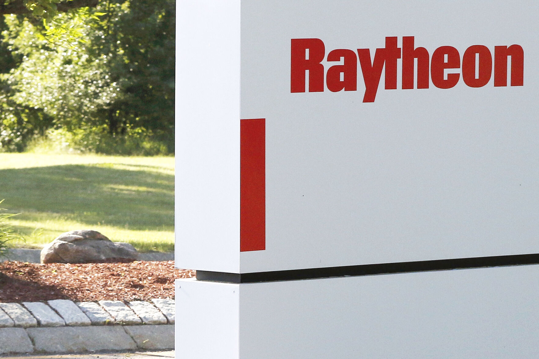 <p>FILE - A sign stands at the road leading to the Raytheon facility in Marlborough, Mass., on June 10, 2019. China on Thursday, Feb. 16, 2023, imposed trade and investment sanctions on U.S. military contractors Lockheed Martin and Raytheon for supplying weapons to Taiwan, stepping up efforts to isolate the island democracy claimed by the ruling Communist Party as part of its territory. (AP Photo/Bill Sikes, File)</p>   PHOTO CREDIT: Bill Sikes