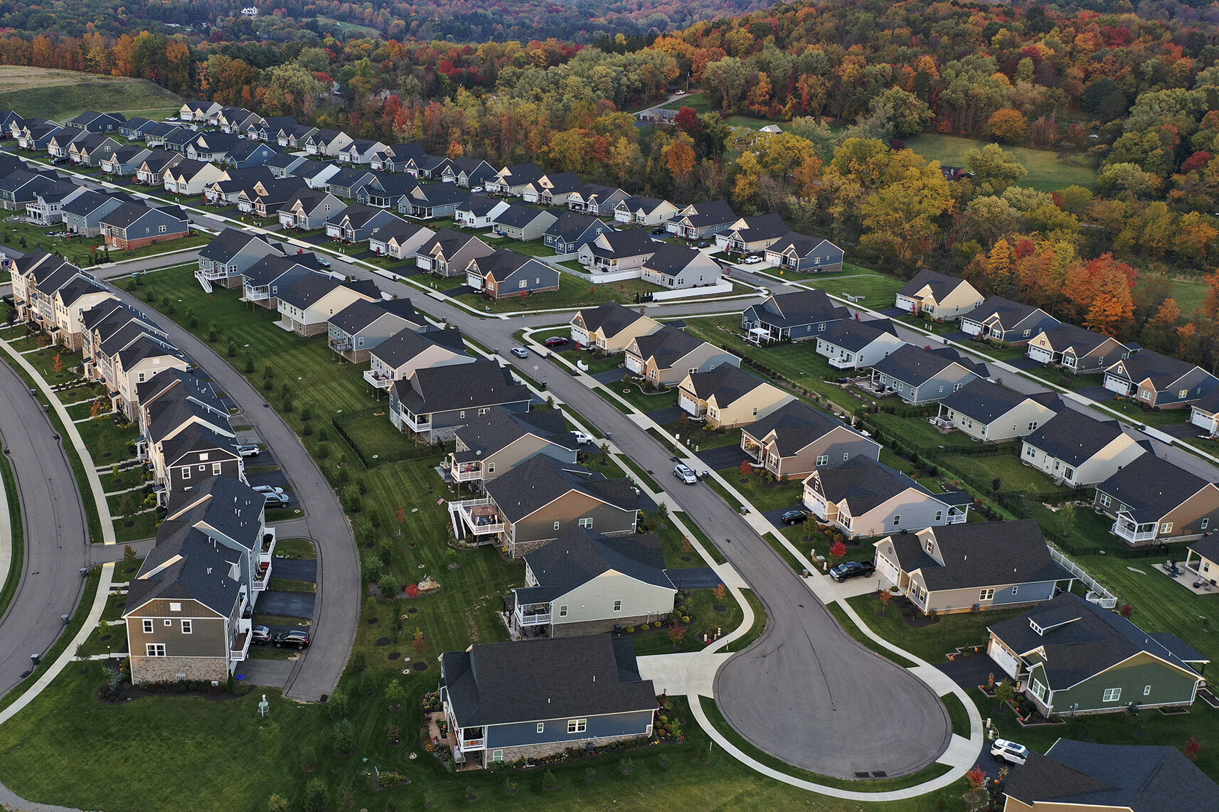 <p>FILE - A cul-de-sac runs through a new housing development in Middlesex Township, Pa., Oct. 12, 2022. The price of natural gas used to heat homes and generate electricity is plunging in 2023, thanks to a mild winter in the U.S. and Europe — bringing some relief to consumers and helping drive down inflation. (AP Photo/Gene J. Puskar, File)</p>   PHOTO CREDIT: Gene J. Puskar 