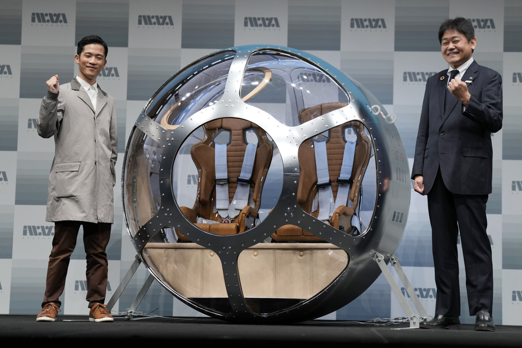 <p>Keisuke Iwaya, left, CEO of a Japanese space development company, Iwaya Giken, and Takayuki Hanasaka, JTB Senior Managing Executive Officer, pose for a photo after unveiling a two-seater cabin and a balloon that the company says is capable of rising to an altitude of 15 miles, which is roughly the middle of the stratosphere, as he speaks during a news conference in Tokyo, Tuesday, Feb. 21, 2023. (AP Photo/Eugene Hoshiko)</p>   PHOTO CREDIT: Eugene Hoshiko 