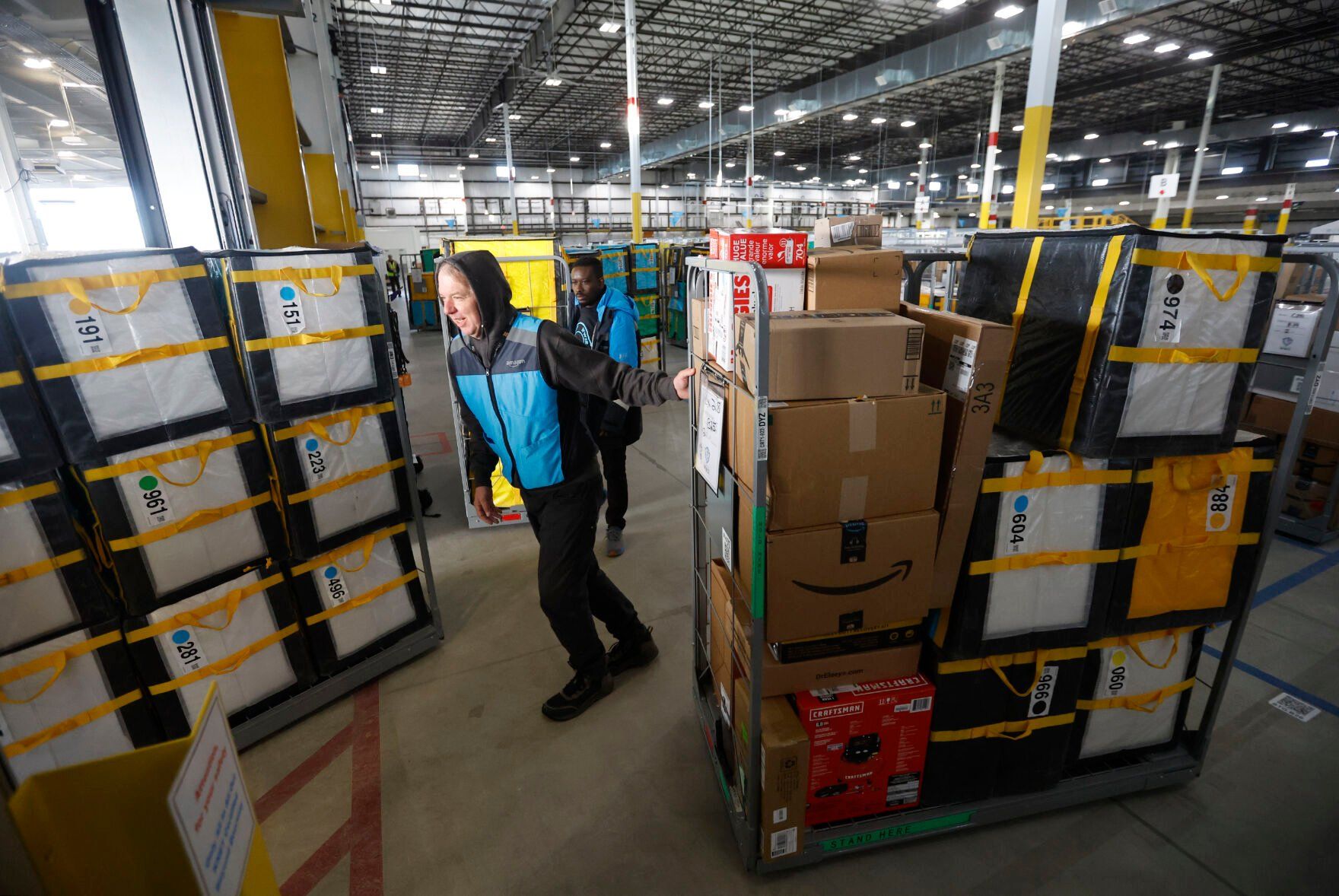 Steven Hemmer loads packages into vehicles at Amazon in Dubuque on Tuesday, Feb. 21, 2023.    PHOTO CREDIT: JESSICA REILLY