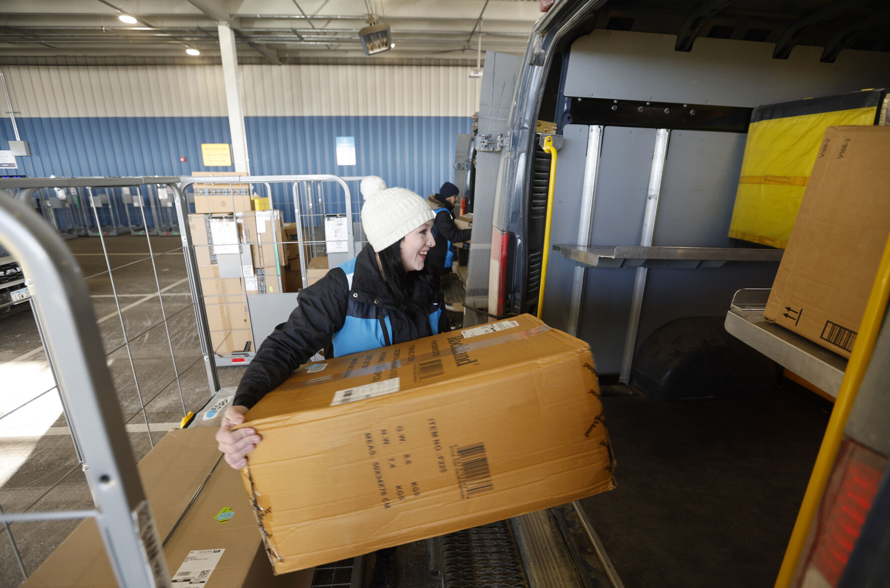 Kayla McLaughlin loads packages into vehicles at Amazon in Dubuque on Tuesday, Feb. 21, 2023.    PHOTO CREDIT: JESSICA REILLY