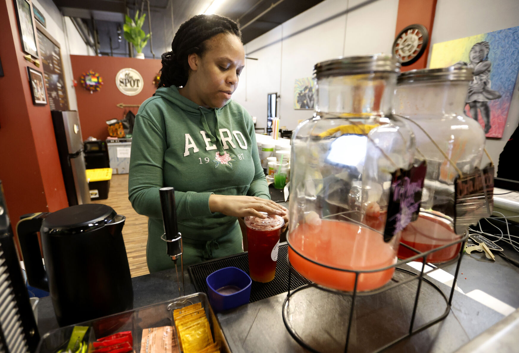 Angela Lee makes a drink at The Spot Nutrition in Dubuque.    PHOTO CREDIT: Jessica Reilly