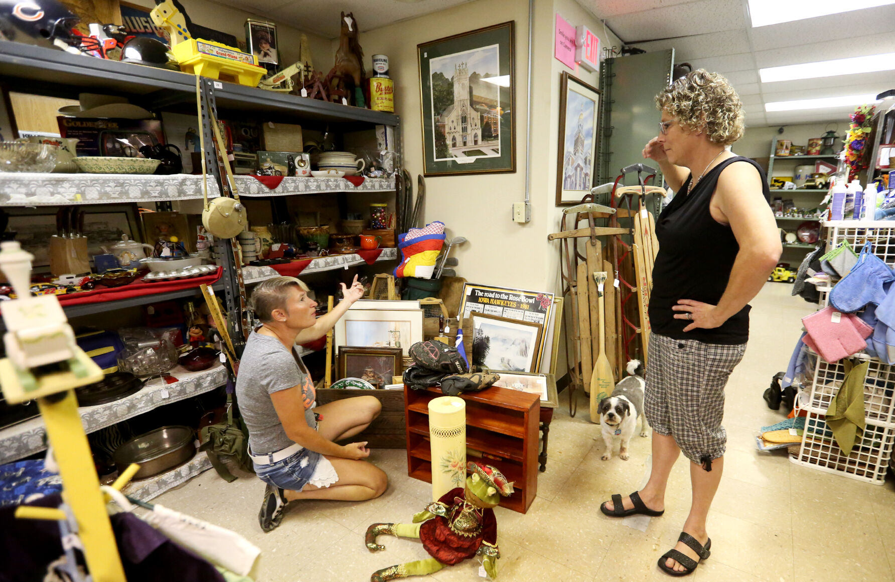 Lisa Appel, of East Dubuque, Ill., talks with Lisa Hammel at Shaggy’s Indoor Flea Market in Dubuque in 2017. Lisa and her dad, Jim Appel, sell merchandise at the store.    PHOTO CREDIT: Jessica Reilly