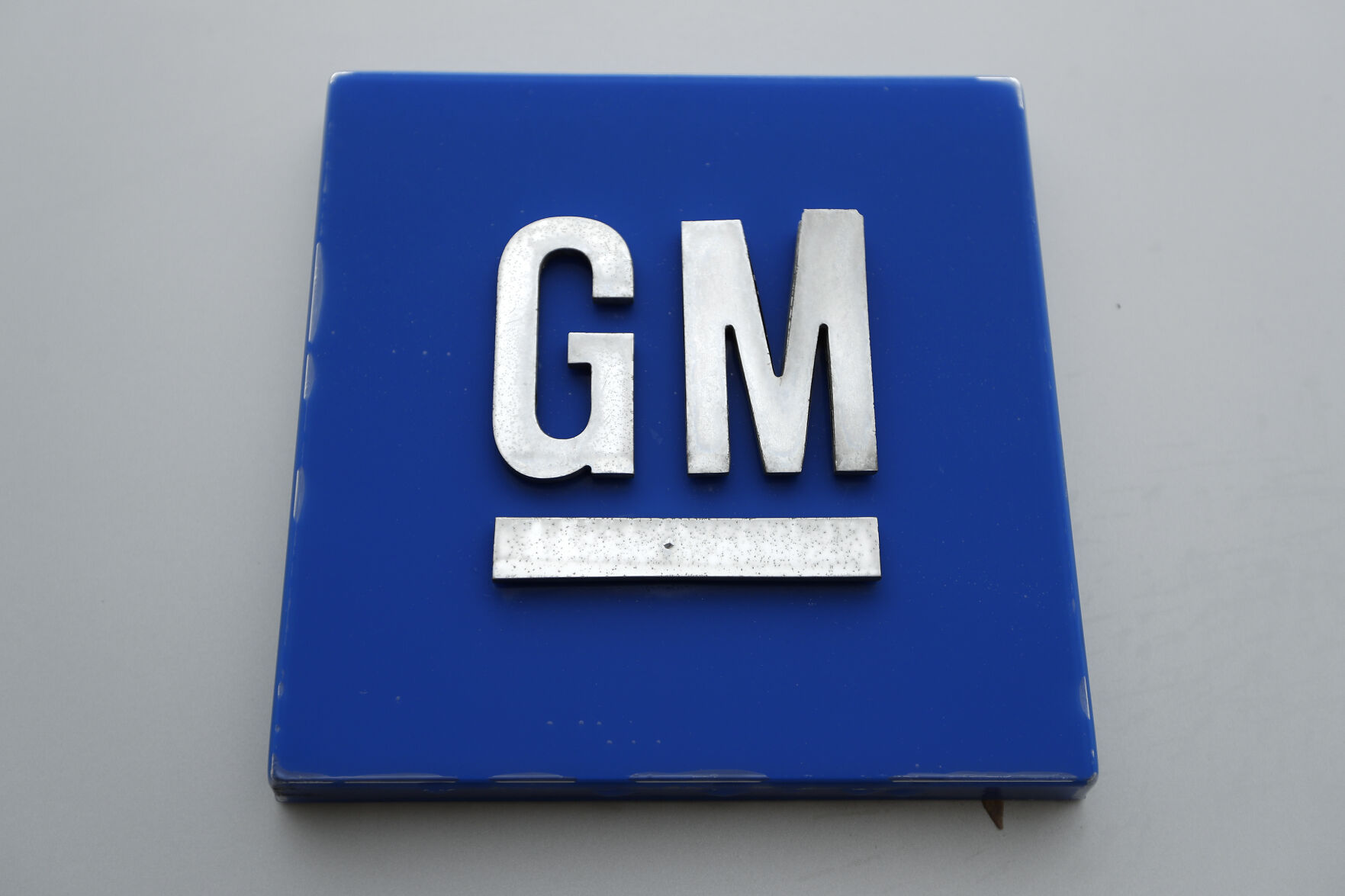 <p>FILE - A General Motors logo is displayed outside the General Motors Detroit-Hamtramck Assembly plant on Jan. 27, 2020, in Hamtramck, Mich. General Motors is making some performance-related job cuts, Wednesday, March 1, 2023, among some of its salaried employees and executives. The Detroit automaker did not specify how many jobs would be eliminated, but did say it would impact a relatively small number of workers. (AP Photo/Paul Sancya, File)</p>   PHOTO CREDIT: Paul Sancya 