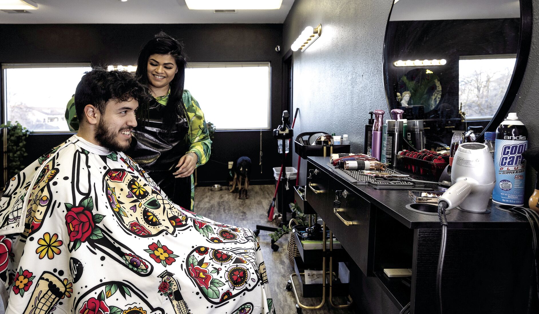 Owner Ana Neuhaus cuts Jose Cardenas’ hair at King Kutz, which opened in Dubuque in January.    PHOTO CREDIT: Stephen Gassman