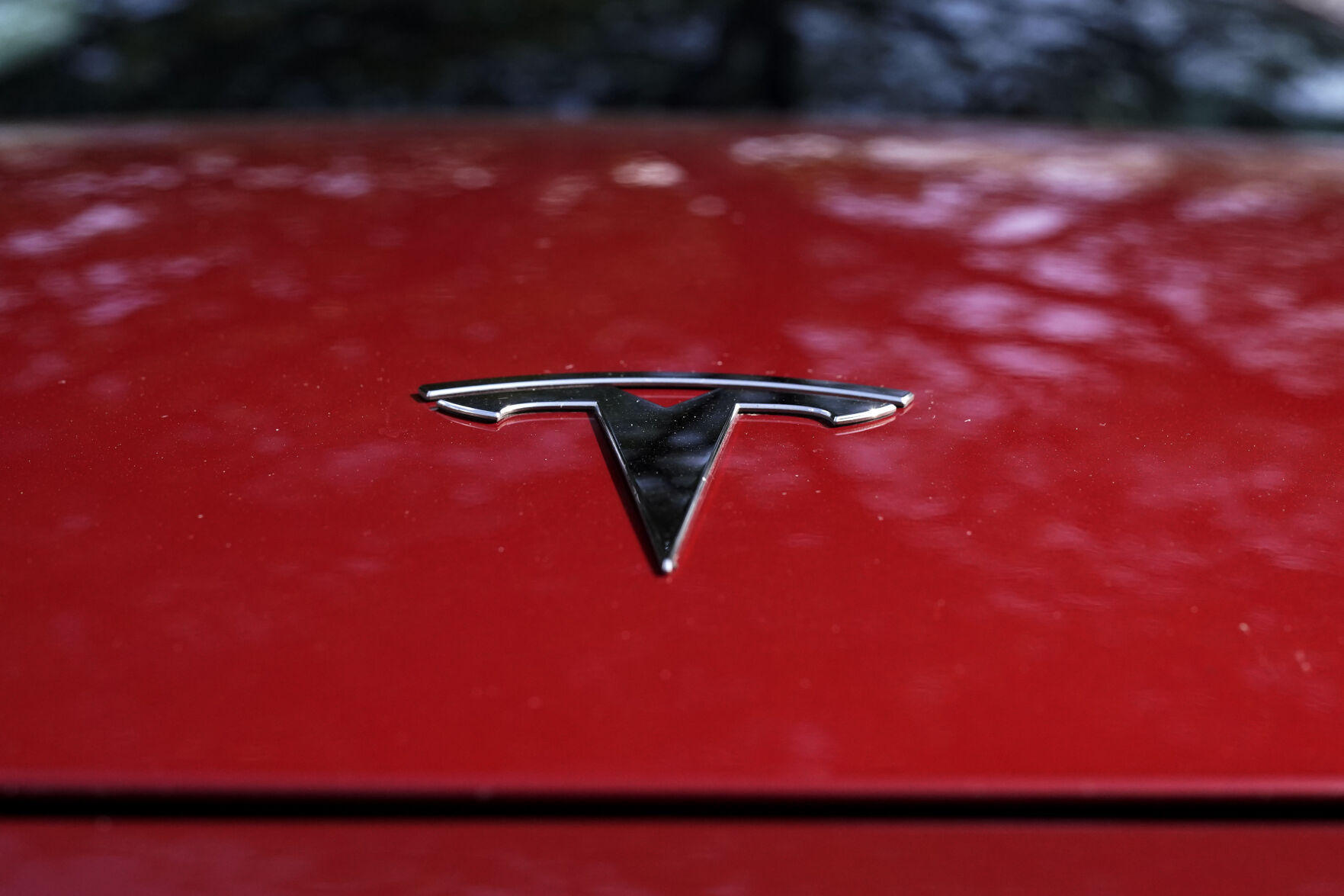 <p>FILE - A Tesla logo is seen on a vehicle on display in Austin, Texas, Wednesday, Feb. 22, 2023. On Wednesday, March 1, Tesla executives said the company will use innovative manufacturing techniques and smaller factories to cut the cost of its next generation of vehicles by as much as half of the ones it now builds. (AP Photo/Eric Gay, File)</p>   PHOTO CREDIT: Eric Gay 