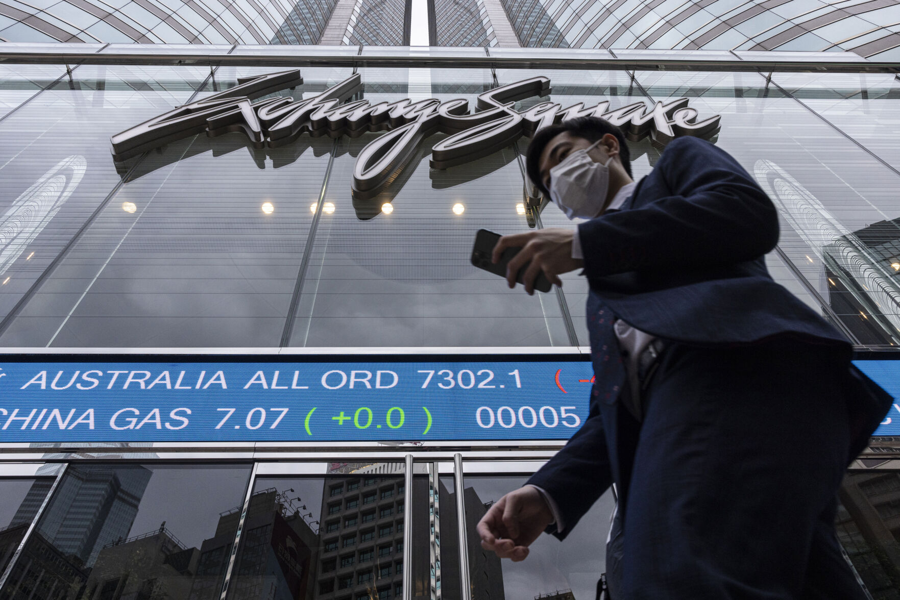 <p>A pedestrian passes by the Hong Kong Stock Exchange electronic screen in Hong Kong on Monday, March 13, 2023. Asian shares mostly fell Monday, shaken by a Wall Street tumble that set off worries the biggest U.S. bank failure in nearly 15 years might have ripple effects around the world. (AP Photo/Louise Delmotte)</p>   PHOTO CREDIT: Louise Delmotte 