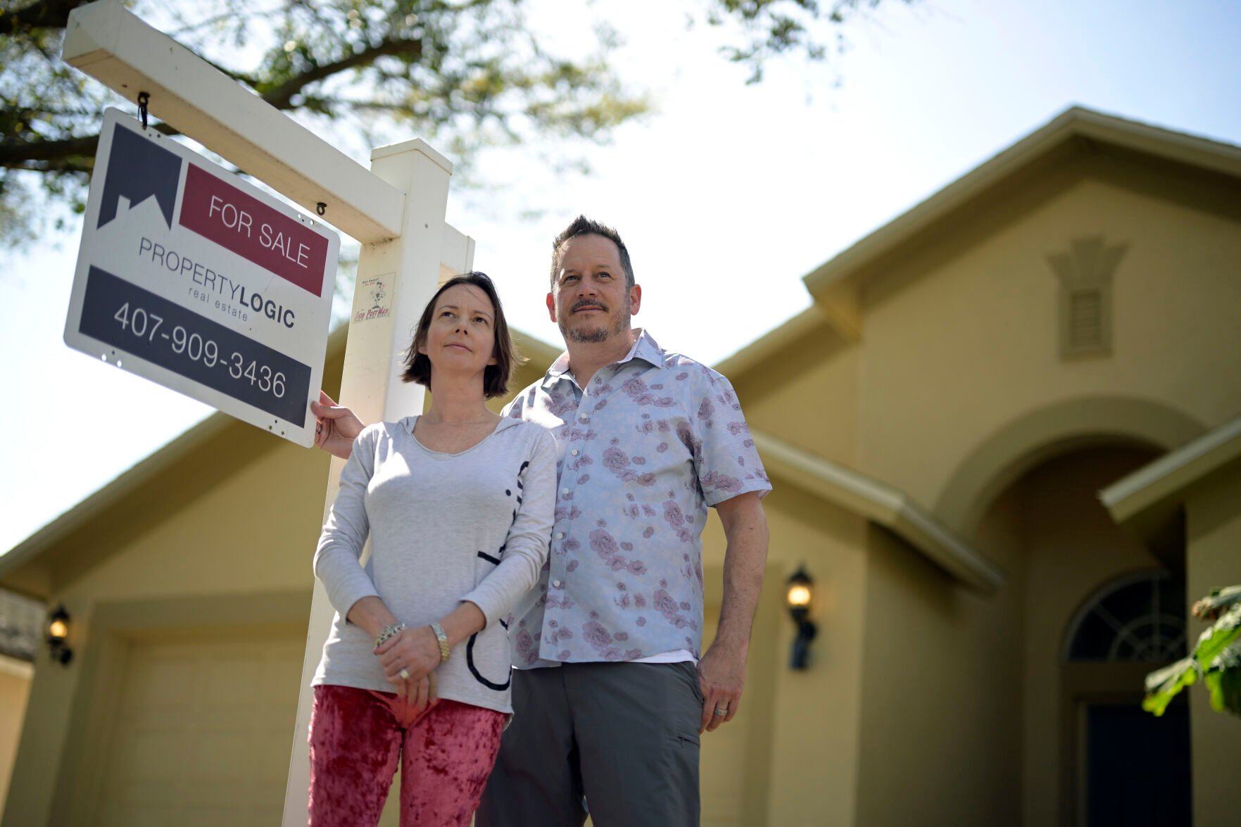 <p>Scott and Sheila Collett stand in front of the home that they recently purchased, Tuesday, Feb. 21, 2023, in Valrico, Fla. Collett negotiated a seller-paid mortgage rate buydown to close the deal on the four-bedroom, two-bathroom house with a pool. (AP Photo/Phelan M. Ebenhack)</p>   PHOTO CREDIT: Phelan M. Ebenhack 