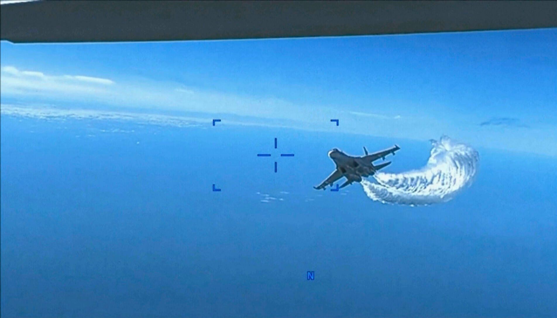 <p>This photo taken from video released on Thursday, March 16, 2023, shows a Russian Su-27 approaching the back of the MQ-9 drone and beginning to release fuel as it passes, over the Black Sea, the Pentagon said. The Pentagon has released footage of what it says is a Russian aircraft conducting an unsafe intercept of a U.S. Air Force surveillance drone in international airspace over the Black Sea. (US Department of Defense via AP)</p>   PHOTO CREDIT: U.S. Department of Defense