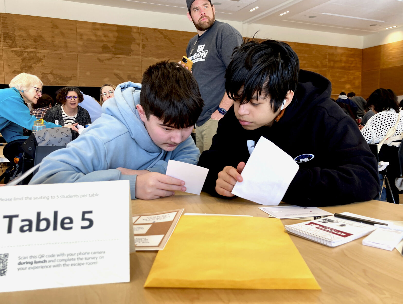<p>Meadowdale High School 9th grade students Juanangel Avila, right, and Legacy Marshall, left, work together to solve an exercise at MisinfoDay, an event hosted by the University of Washington to help high school students identify and avoid misinformation, Tuesday, March 14, 2023, in Seattle. Educators around the country are pushing for greater digital media literacy education. (AP Photo/Manuel Valdes)</p>   PHOTO CREDIT: Manuel Valdes - staff, AP