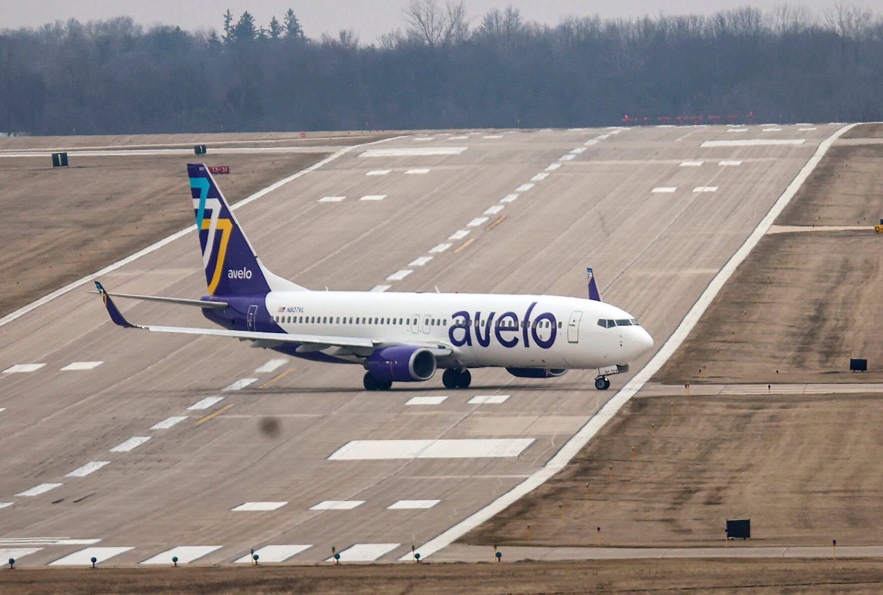 An Avelo Airlines jet taxis down the runway after touching down at the Dubuque Regional Airport for the airlines inaugural flight out of Dubuque on Wednesday, March 22, 2023.    PHOTO CREDIT: Dave Kettering