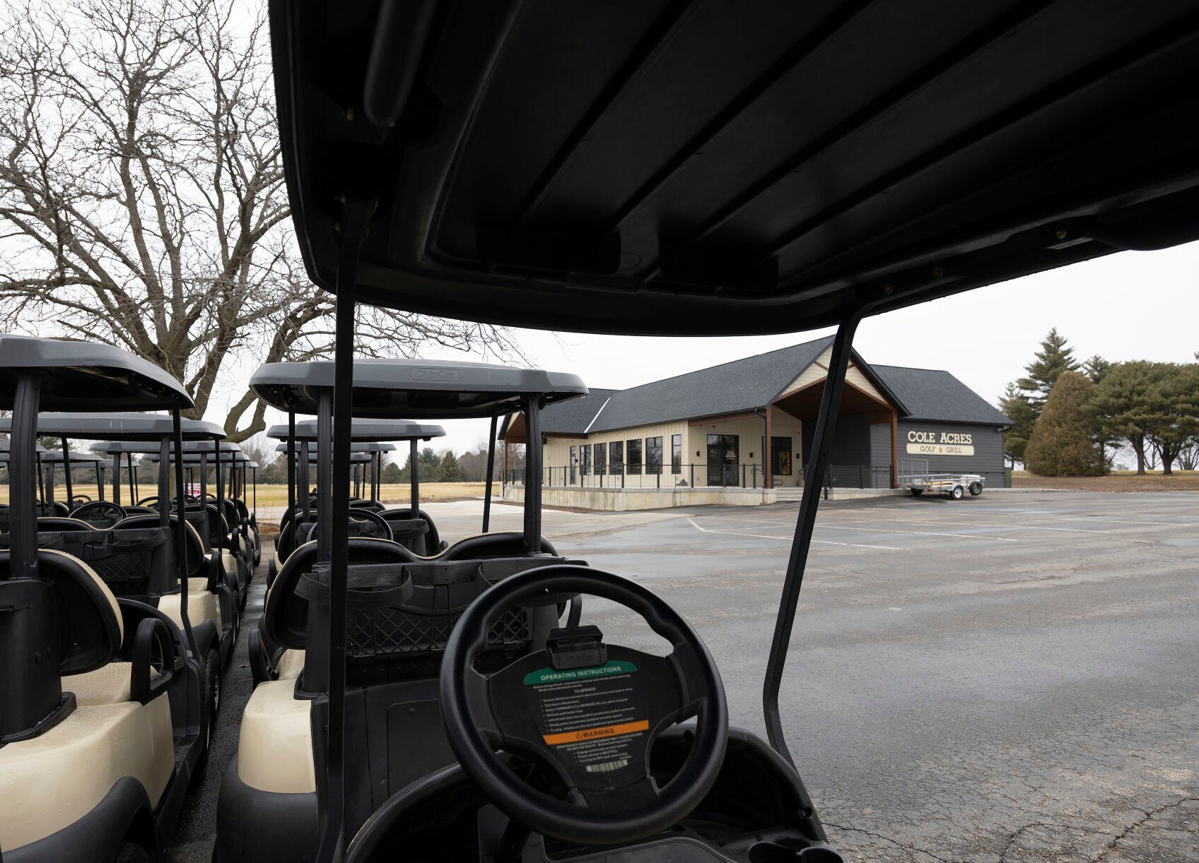 Golf carts and clubhouse at Cole Acres Golf and Grill in Cuba City, Wis., on Thursday.    PHOTO CREDIT: Stephen Gassman